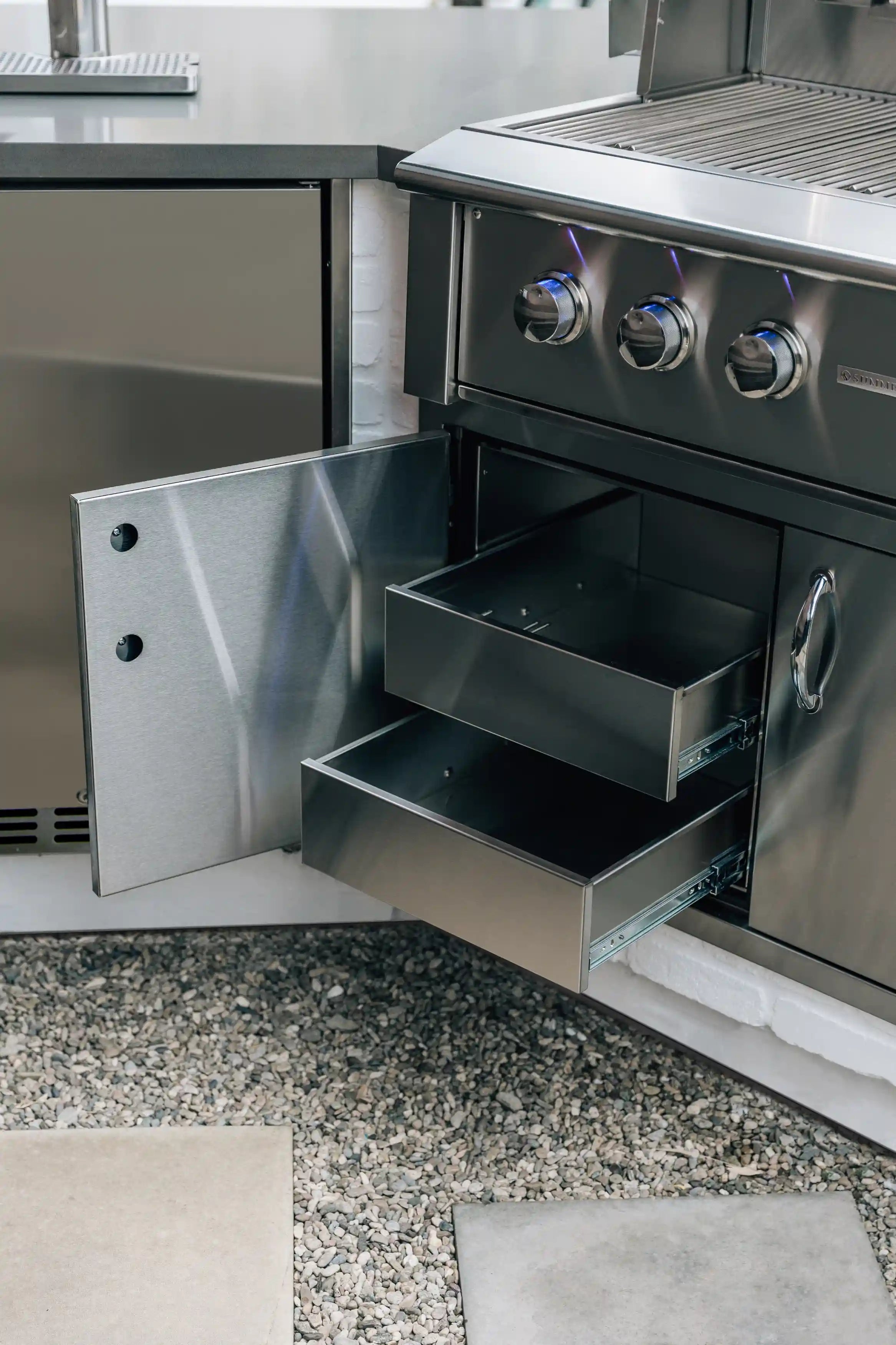 Dry storage pantry cabinet with 2 drawers, open compartments and metal doors