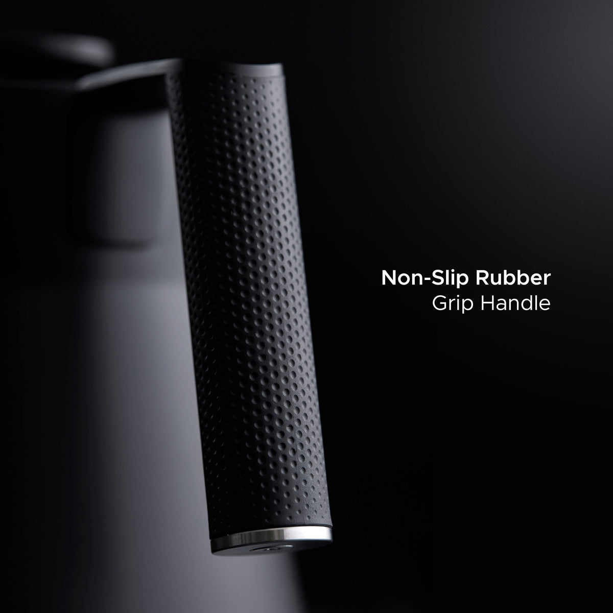 Textured non-slip rubber grip handle on matte black electric kettle