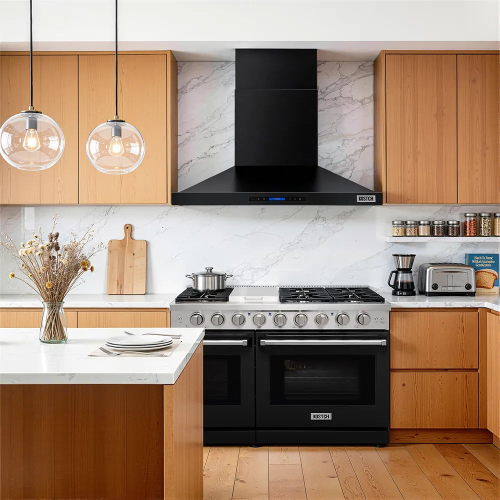 Black convertible wall range hood with chimney and control panel above stove
