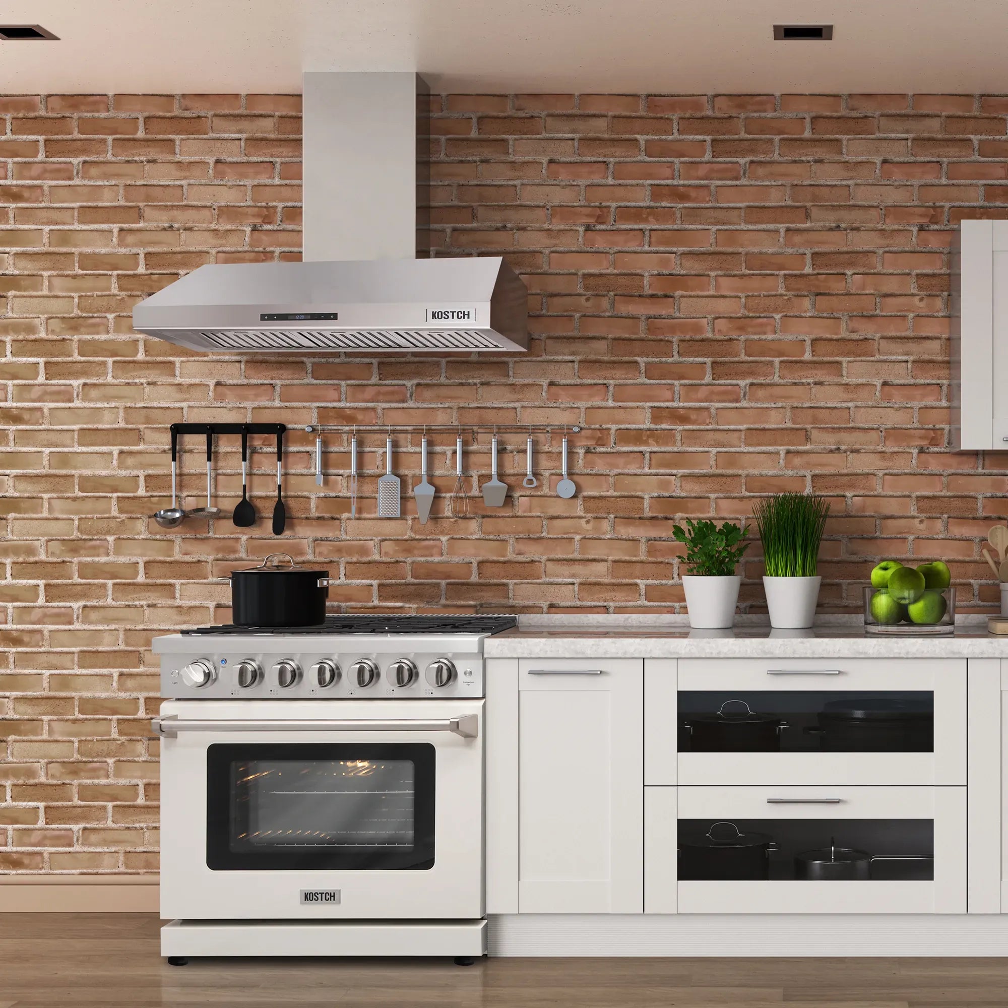 Stainless steel chimney range hood mounted over a cooktop in a kitchen