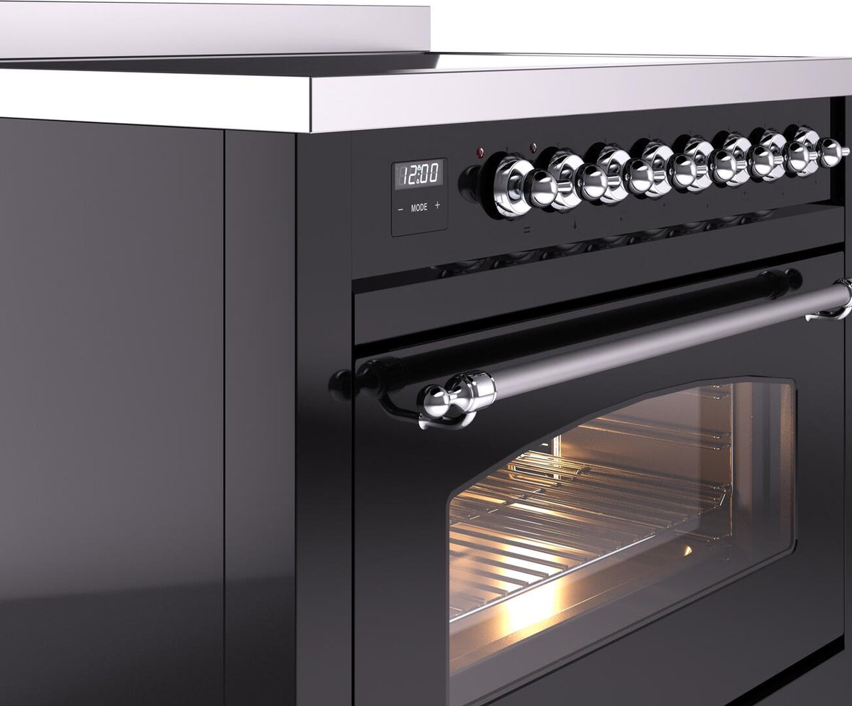 Induction range control panel with chrome knobs and oven door with chrome handle