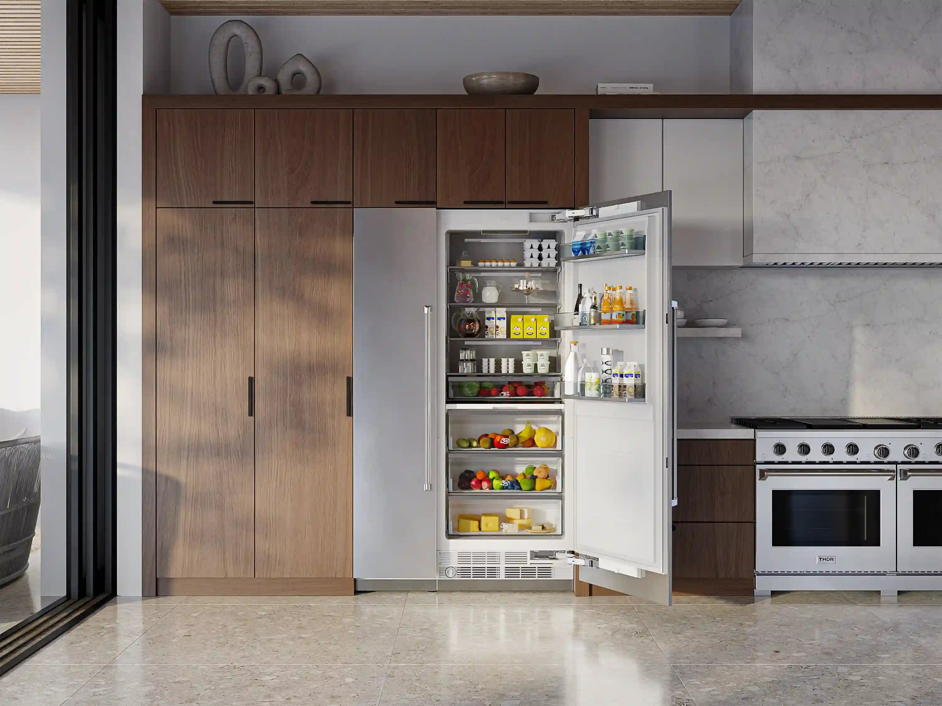 Stainless steel column refrigerator-freezer with doors open, interior shelves and drawers visible