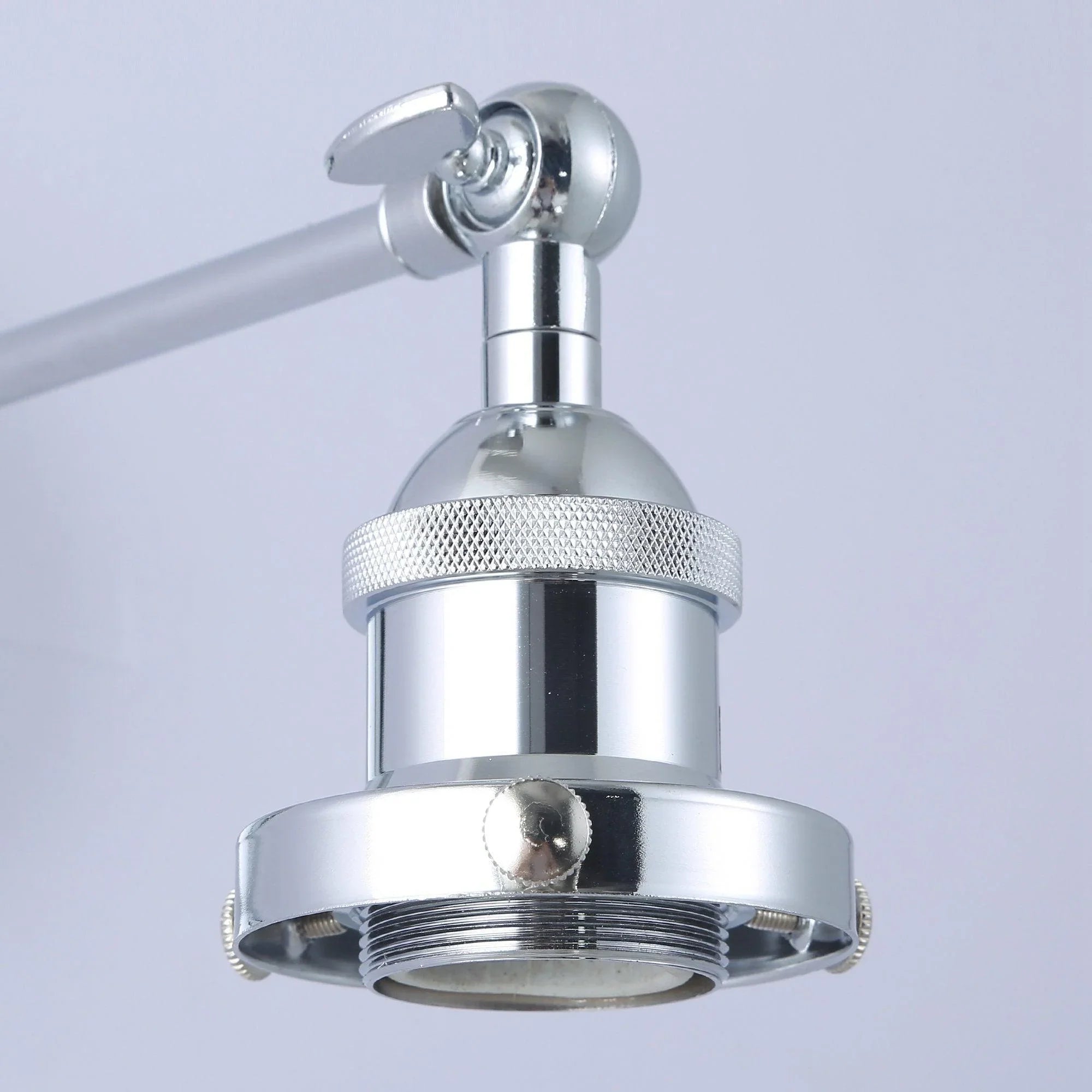 Silver wall sconce head with textured collar and visible socket under the shade