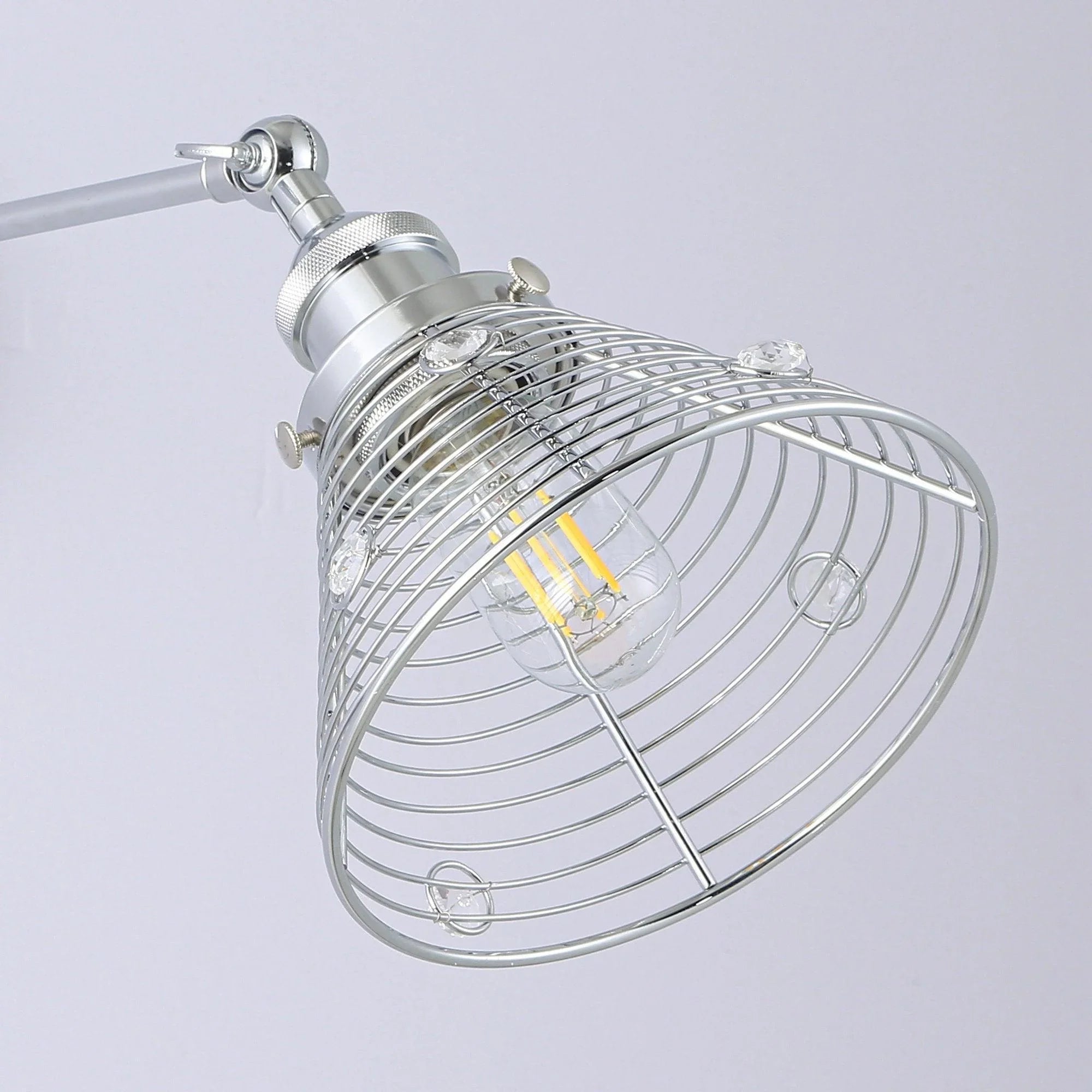 Silver 1-light modern wall sconce with wire cage shade and clear bulb inside