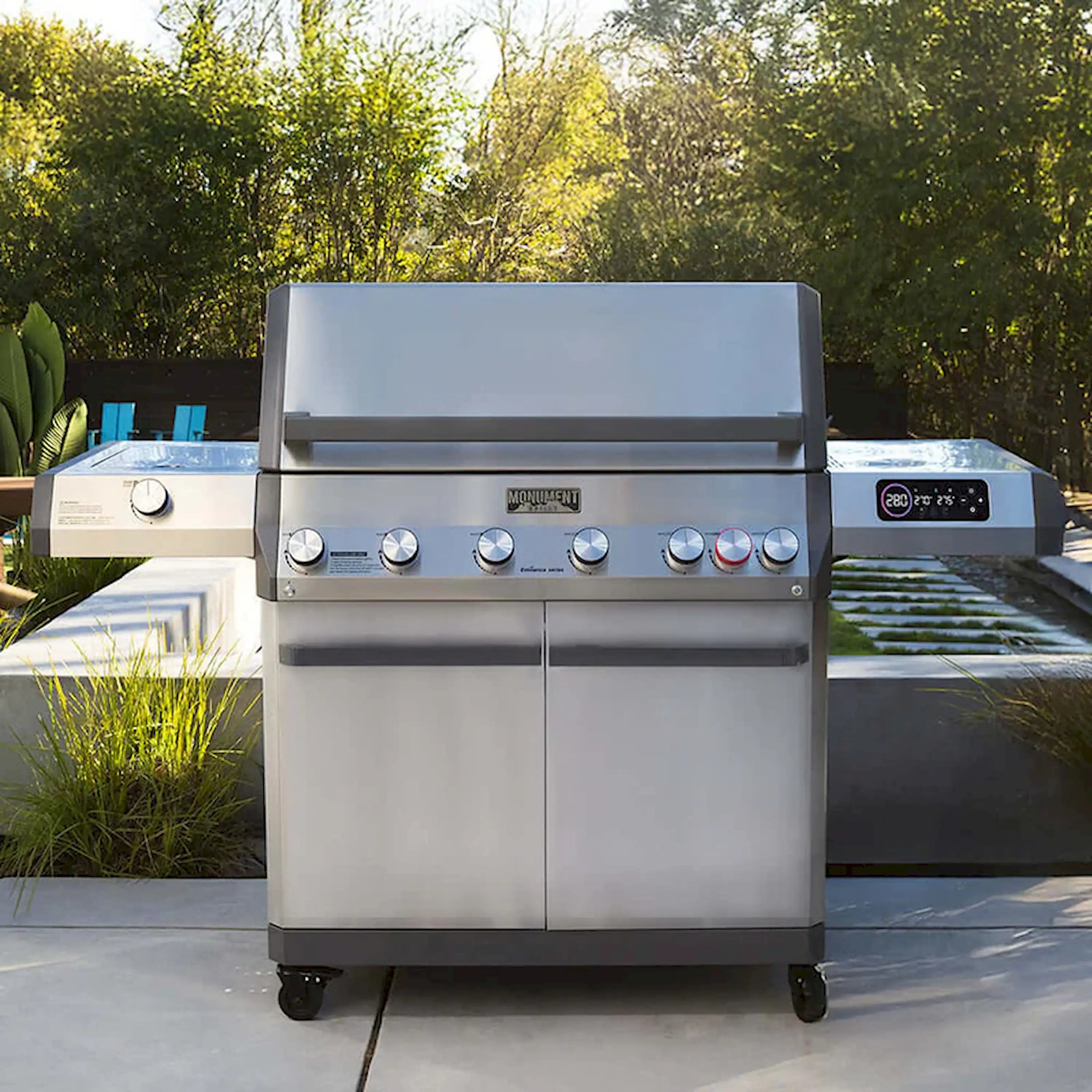 Stainless steel gas grill on cart with front controls and side shelves outdoors
