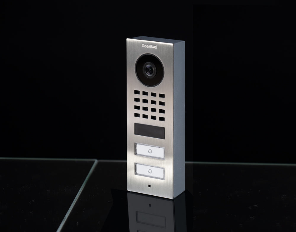 DoorBird video door station, metallic faceplate with camera lens and call buttons
