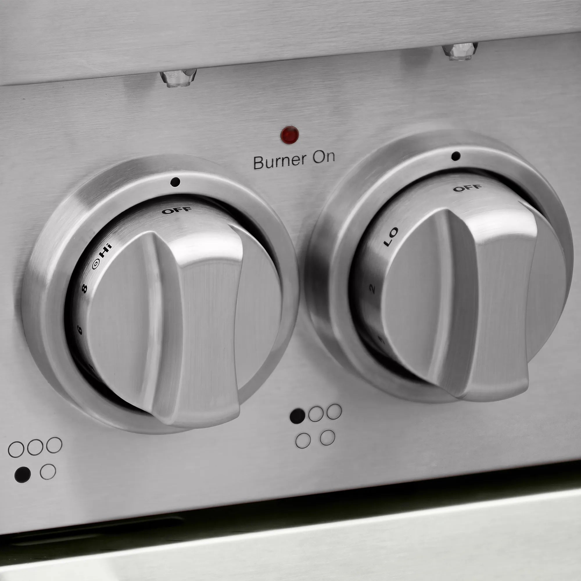 Stainless electric range front with two burner knobs and red burner-on indicator