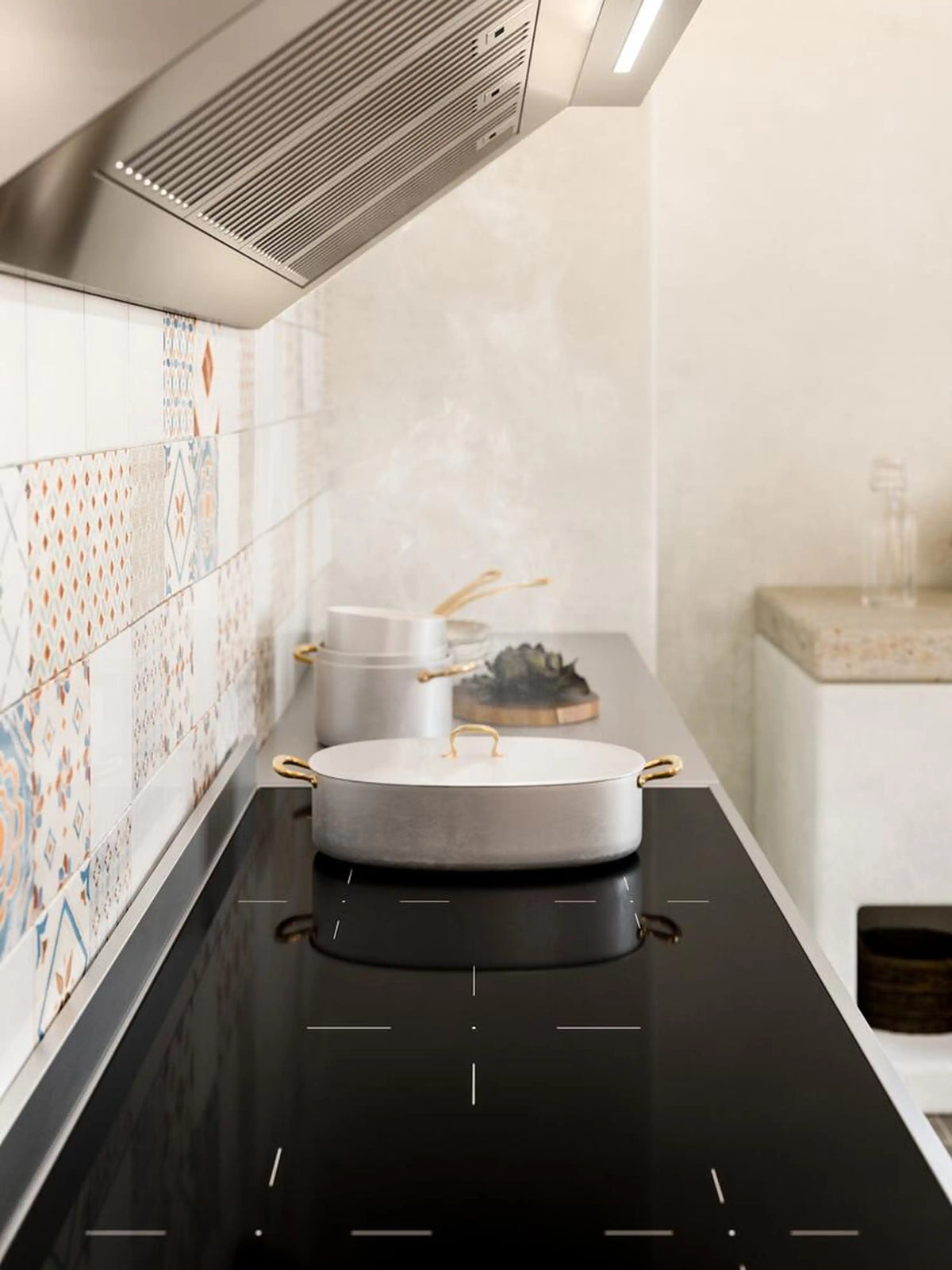 Matte graphite induction range installed in a kitchen with hood above and cooktop visible.