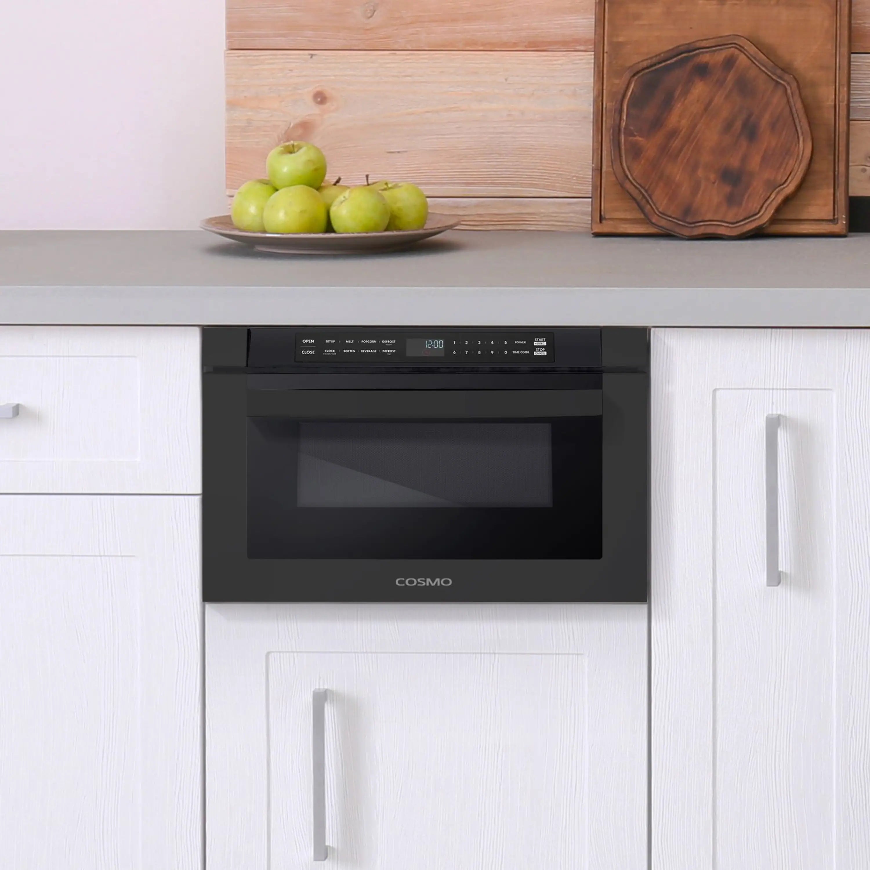 Built-in microwave drawer installed in cabinetry, matte black front with controls