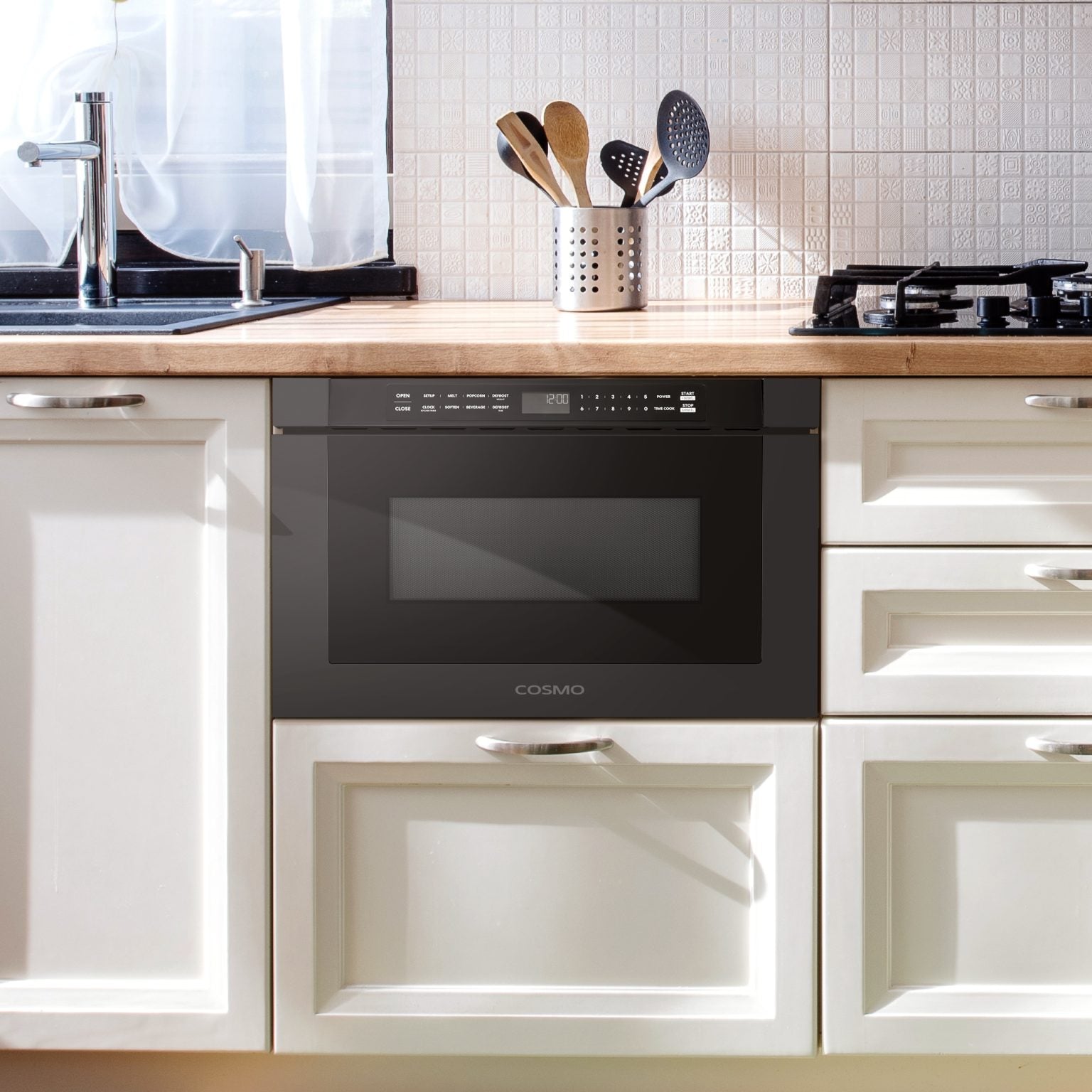 Built-in microwave drawer installed in kitchen cabinetry, black front with display and handle