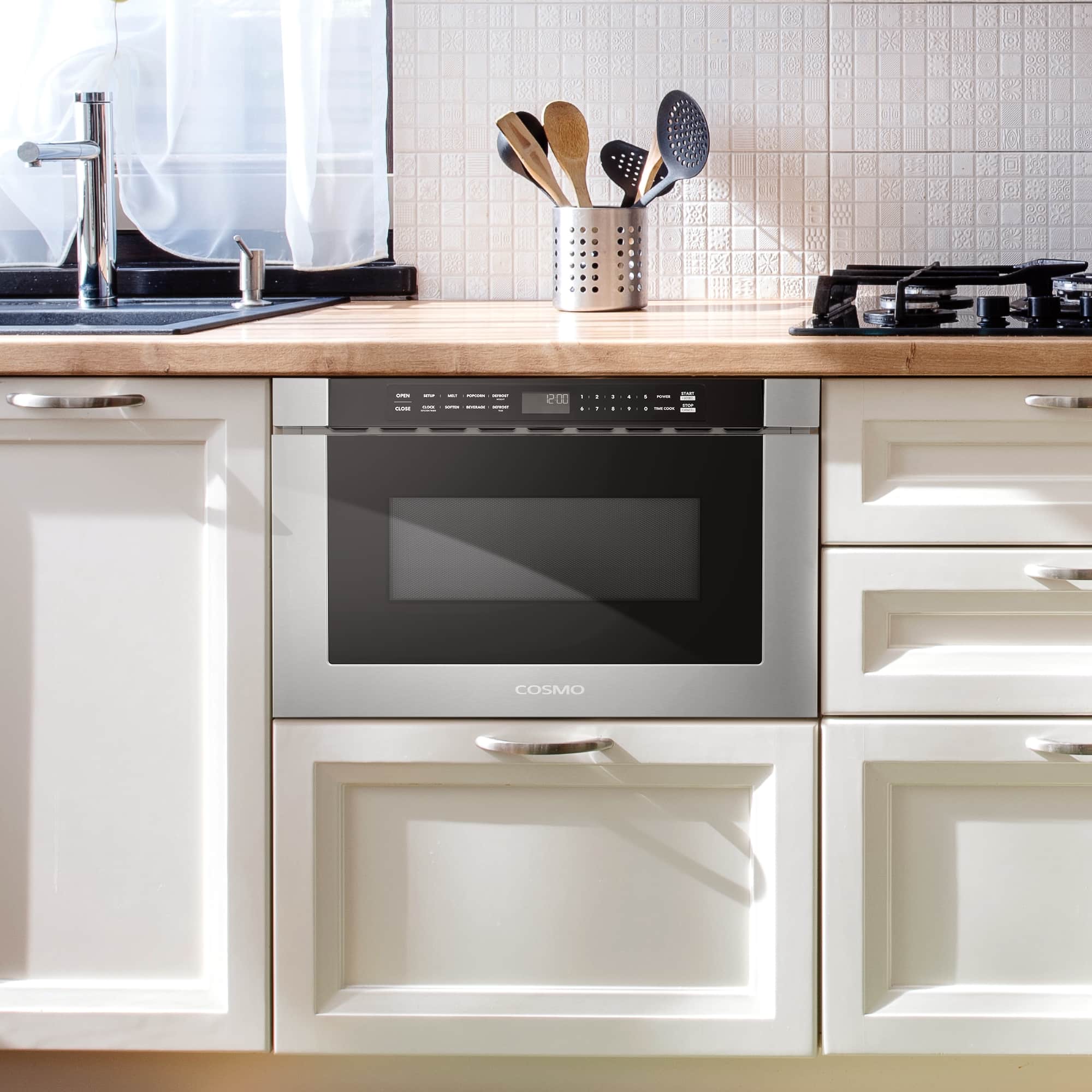 Built-in stainless steel microwave drawer installed in kitchen cabinetry