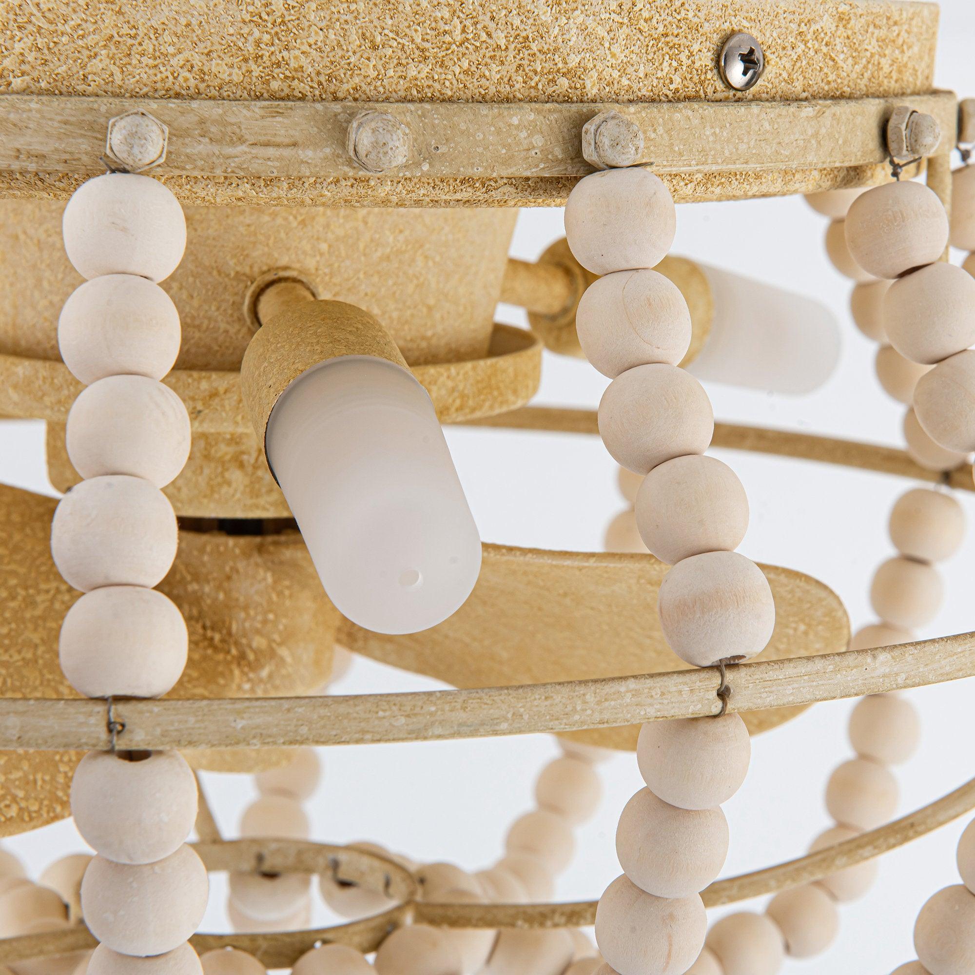 Beige flush-mount ceiling fan light with close-up beaded trim and blade detail