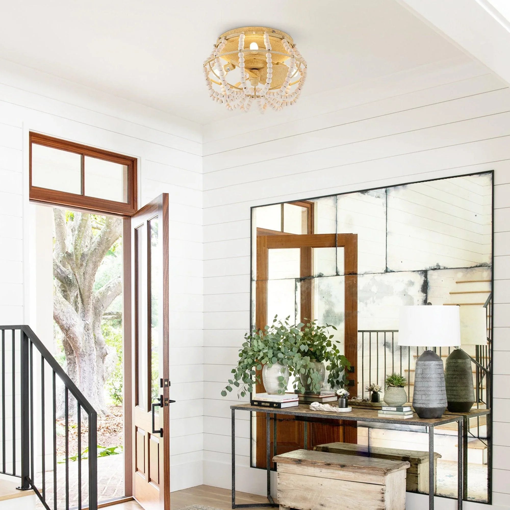 Beige flush-mount ceiling fan light with beaded metal ring, shown on ceiling
