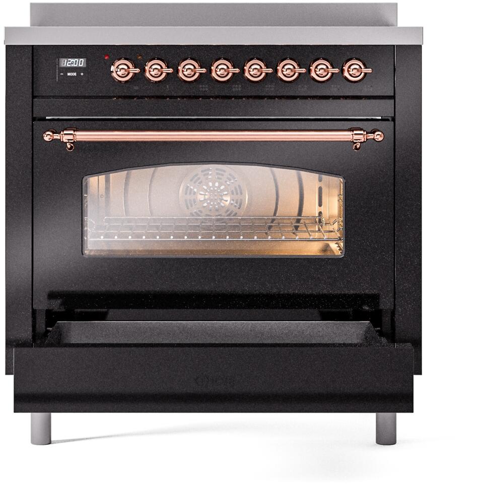 Freestanding induction range oven door with glass window and copper handle.