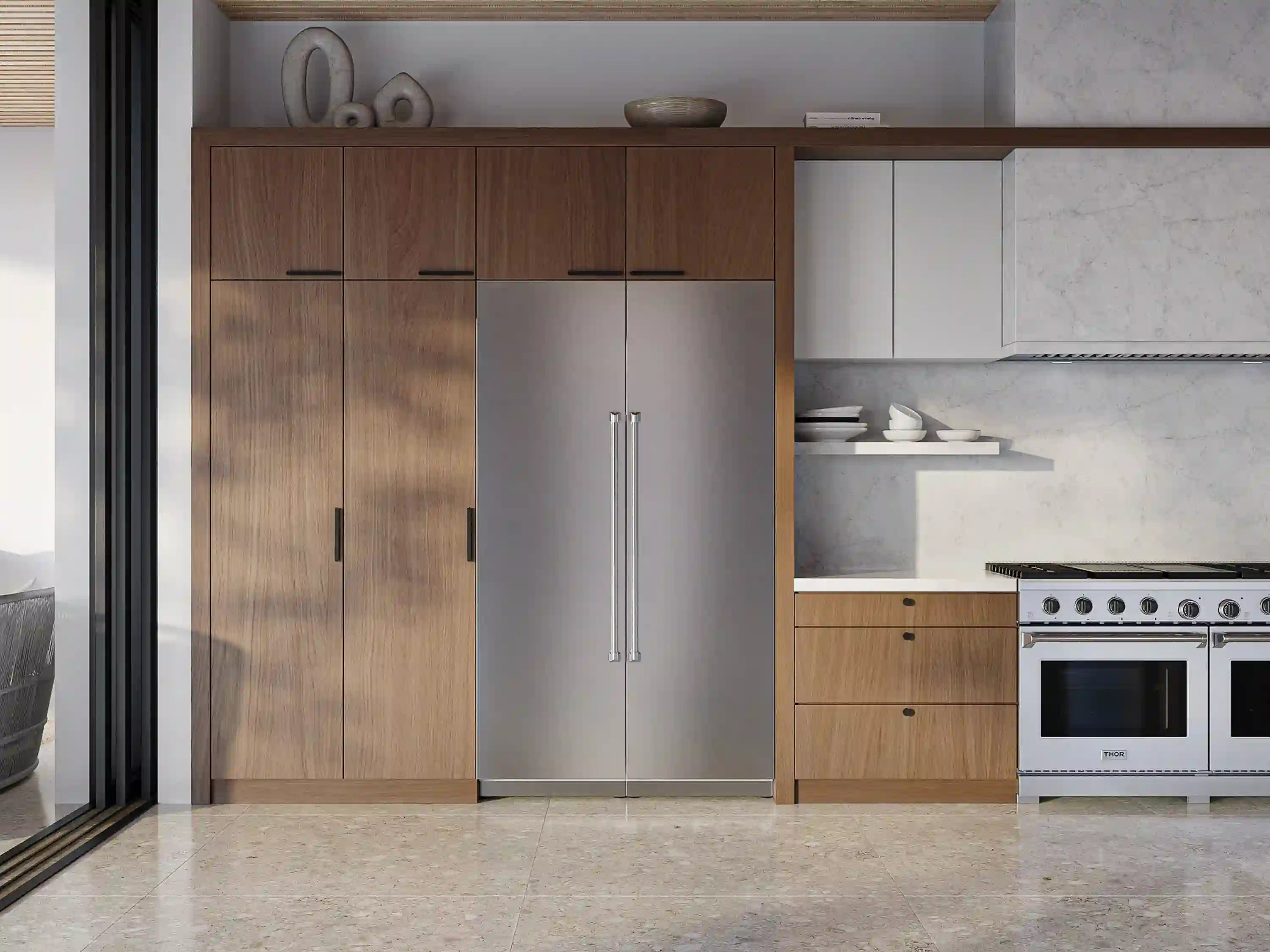 Built-in column refrigerator with stainless steel exterior installed in kitchen cabinetry