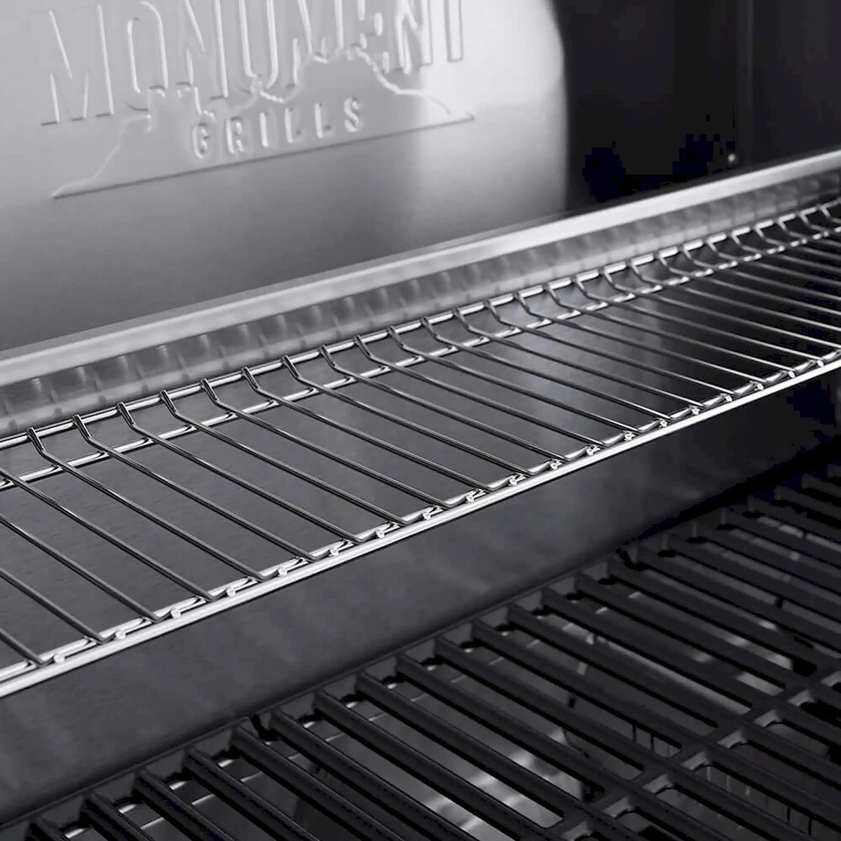 Stainless steel grill grates and warming area on a propane gas grill