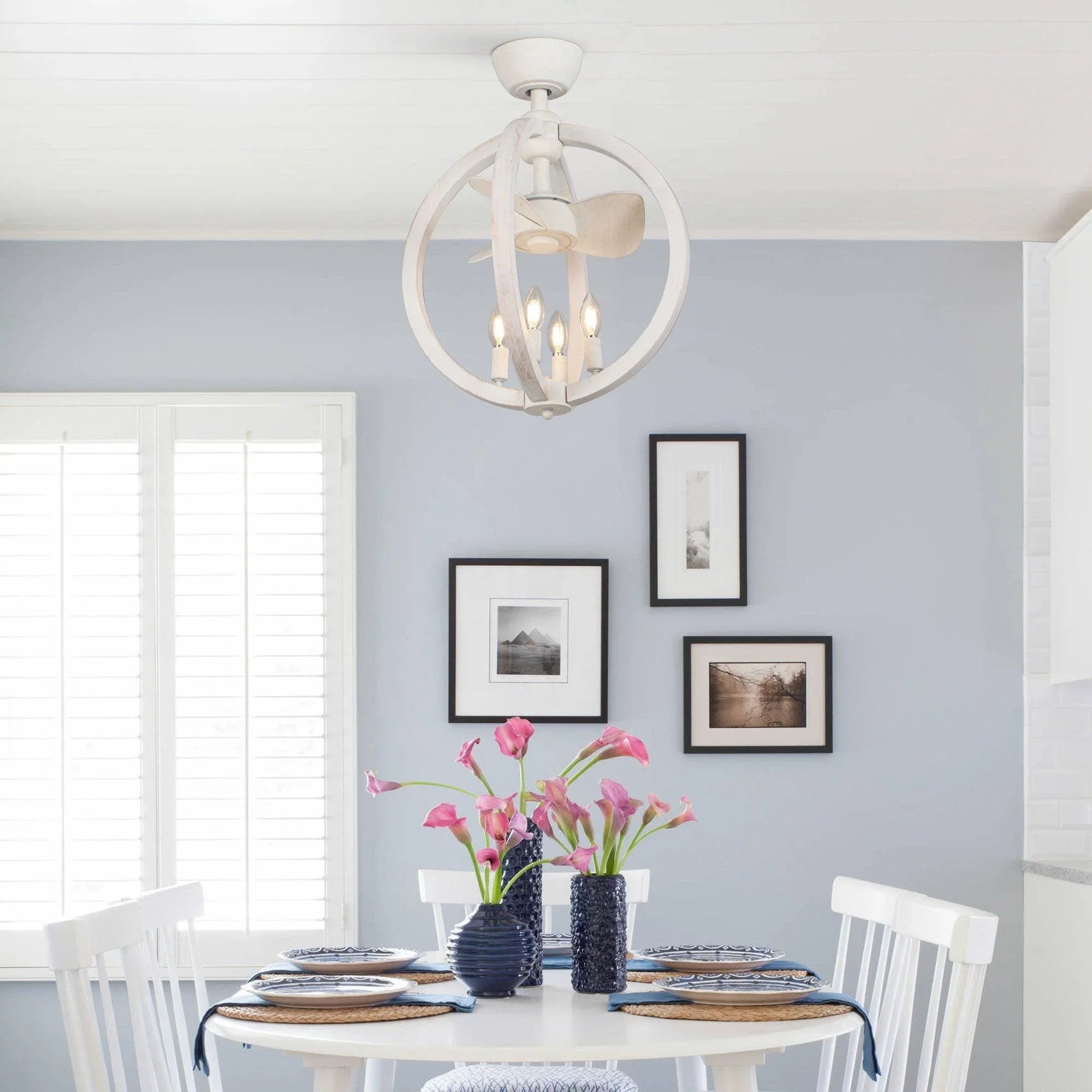 White ceiling fan with light fixture; four blades hang in a circular open design