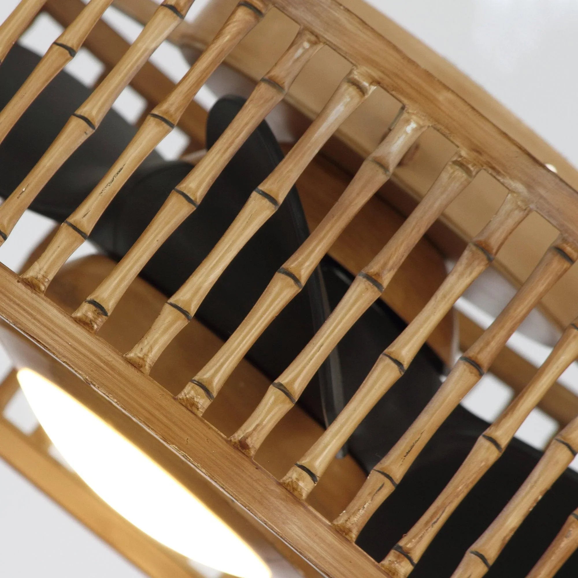 Close-up interior view of brown slats and light opening of the flush mount fan