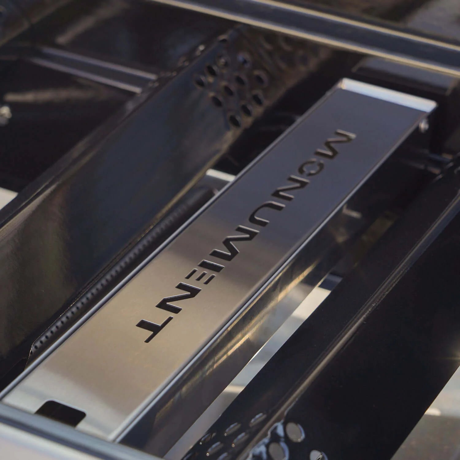 Stainless grill interior panel with Monument Denali text and branding