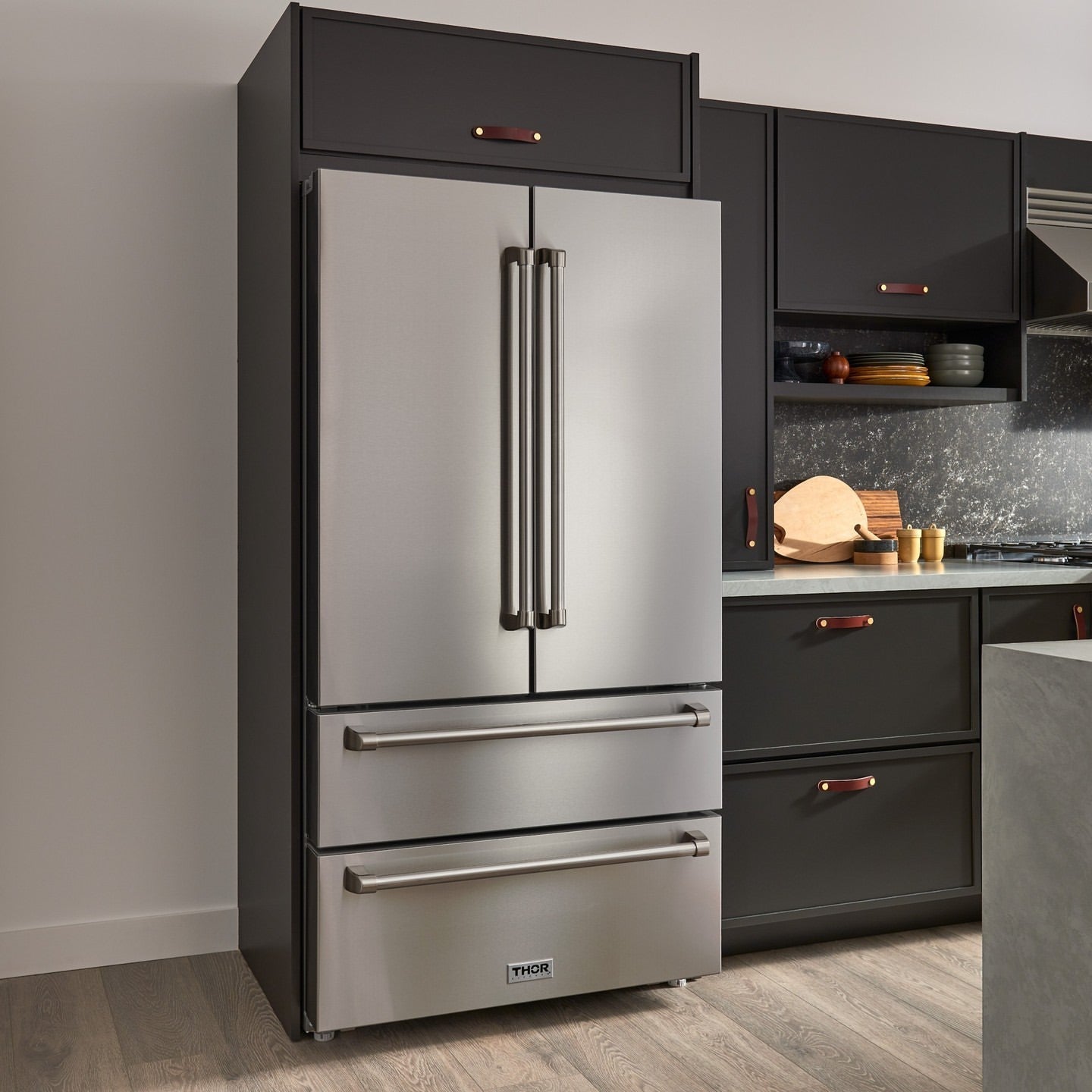 Stainless steel French door refrigerator with bottom freezer and side handles