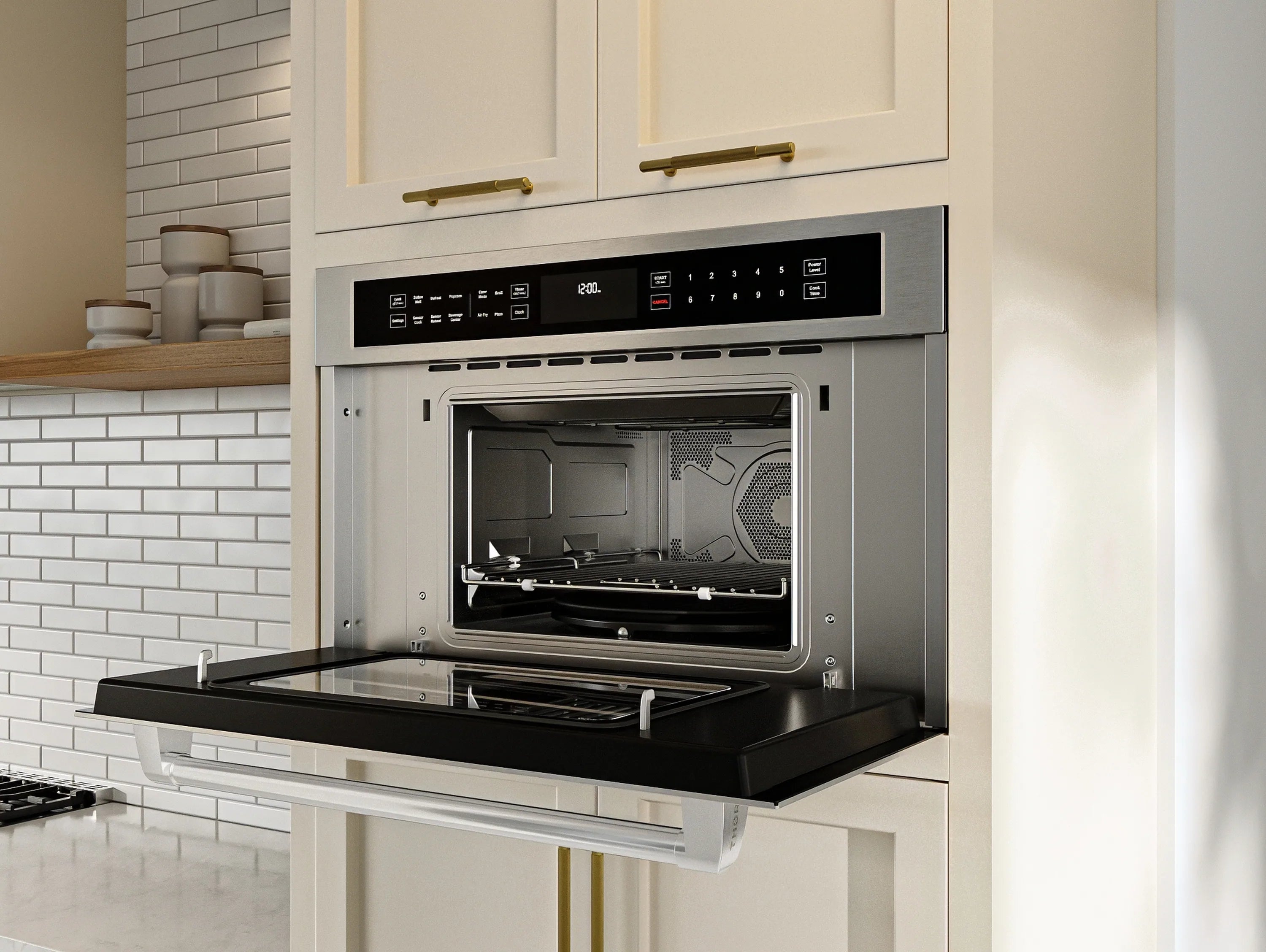 Stainless steel wall oven with open door, interior rack, and countertop pull-out drawer