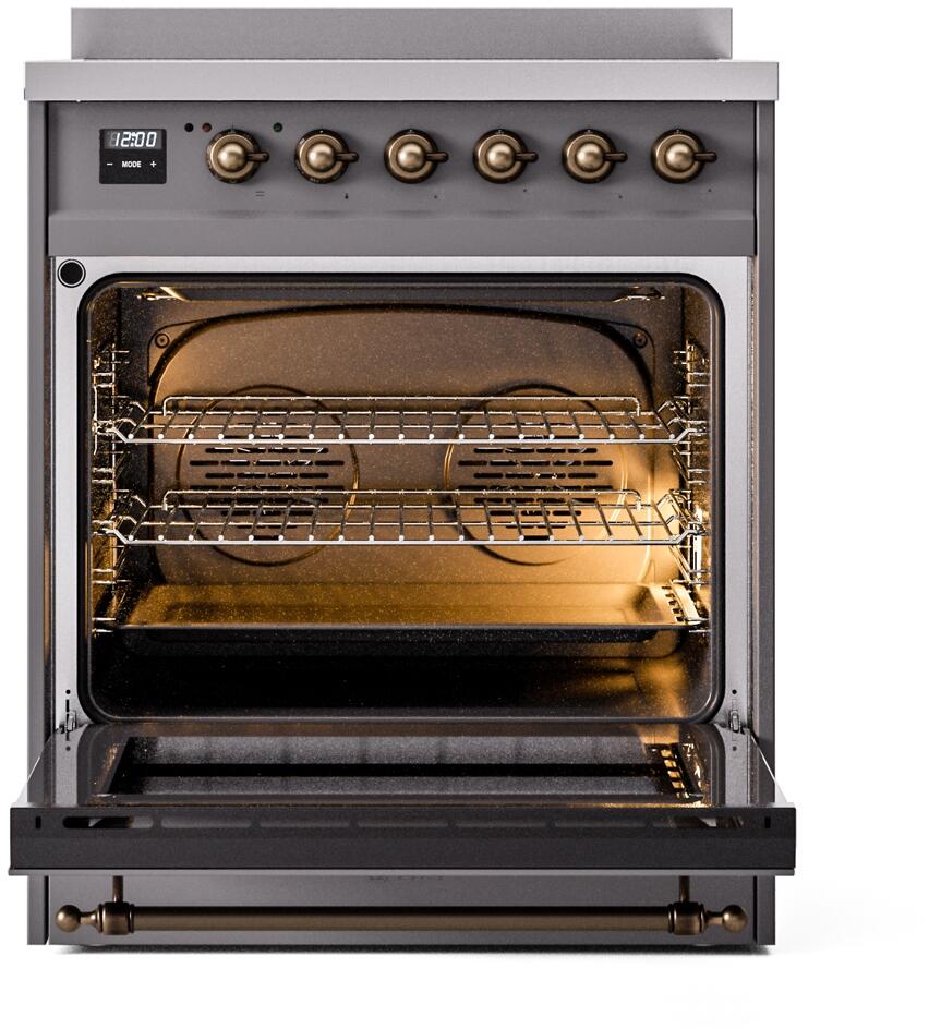 Freestanding electric induction range oven interior with racks and warm light on.