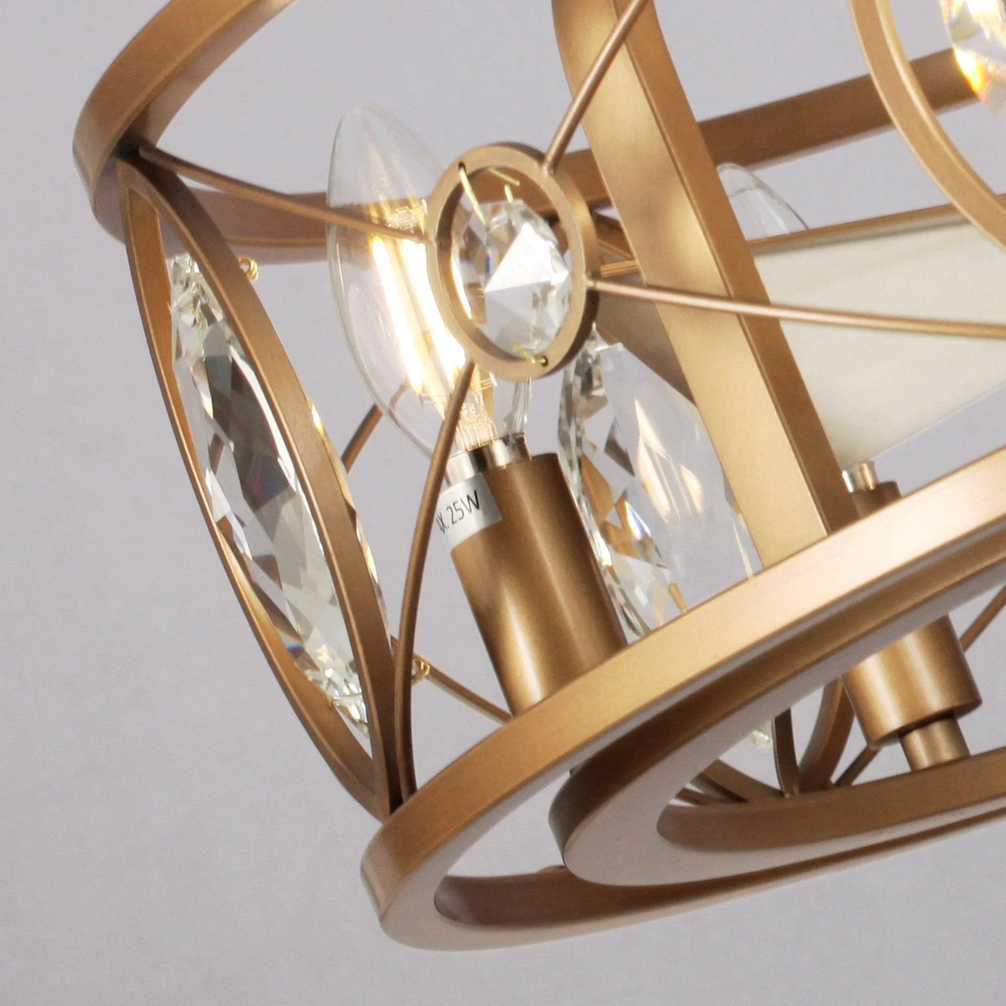 Golden crystal cage ceiling fan chandelier with circular frame and dangling prisms