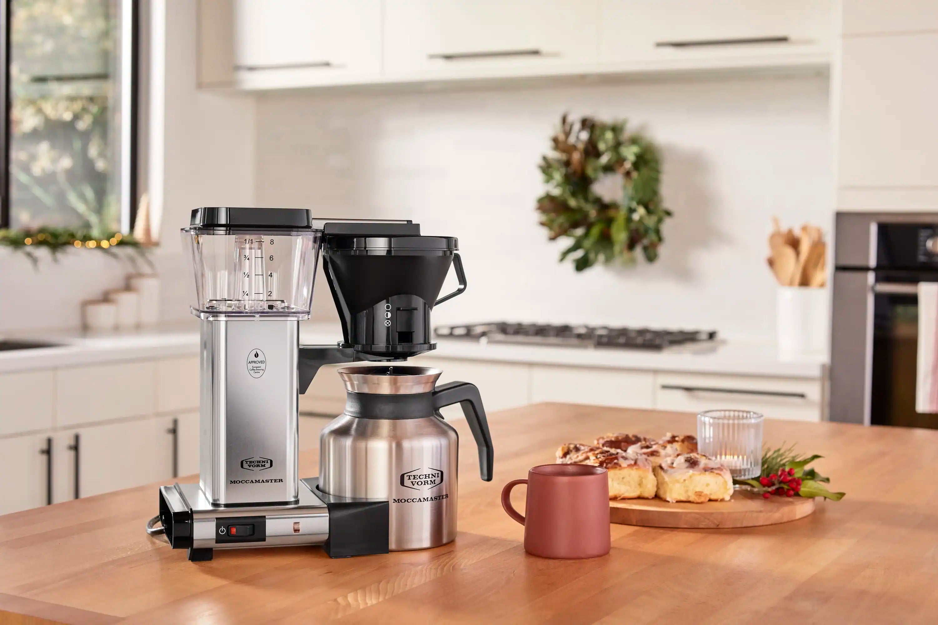 Silver and black thermal carafe coffee maker with drip-stop lever and carafe handle
