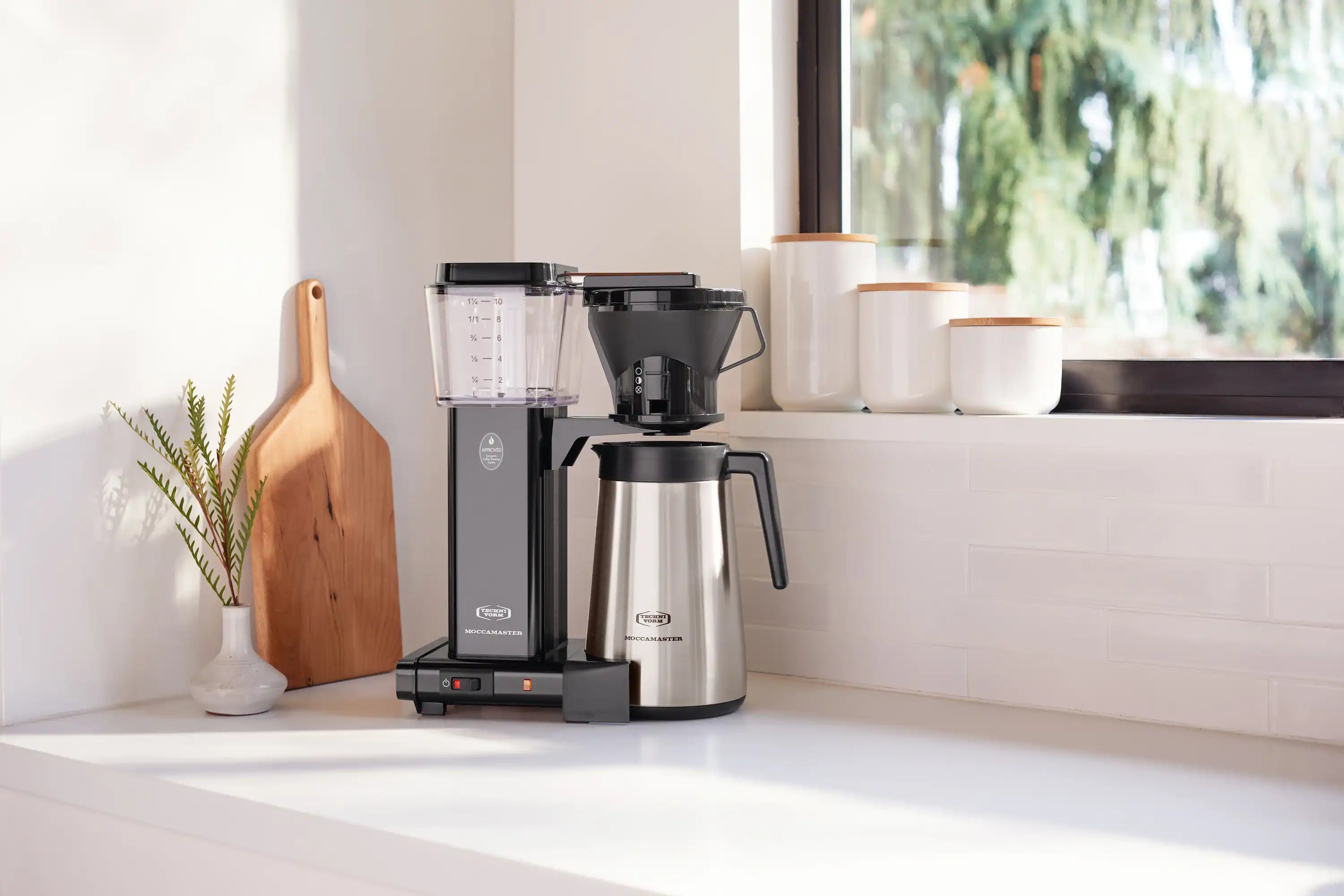 Black 10-cup drip coffee maker with stainless thermal carafe and drip-stop lever