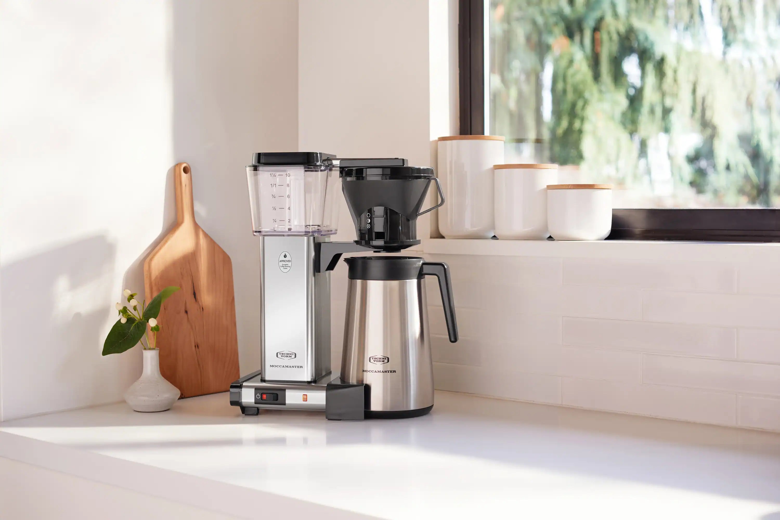 Countertop thermal carafe coffee maker in silver with black brew basket and carafe
