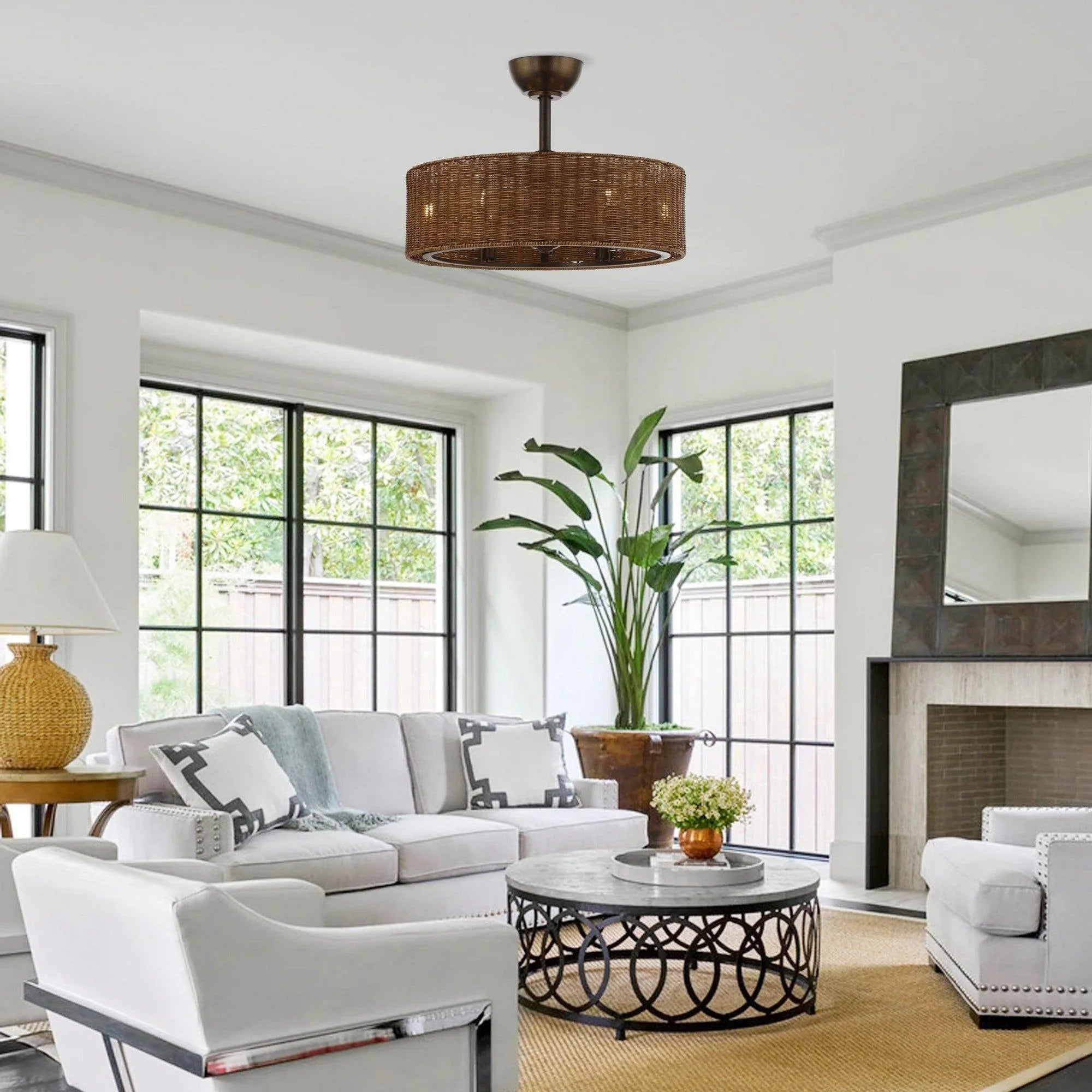 Farmhouse ceiling fan with woven wicker shade mounted on oil-rubbed bronze downrod