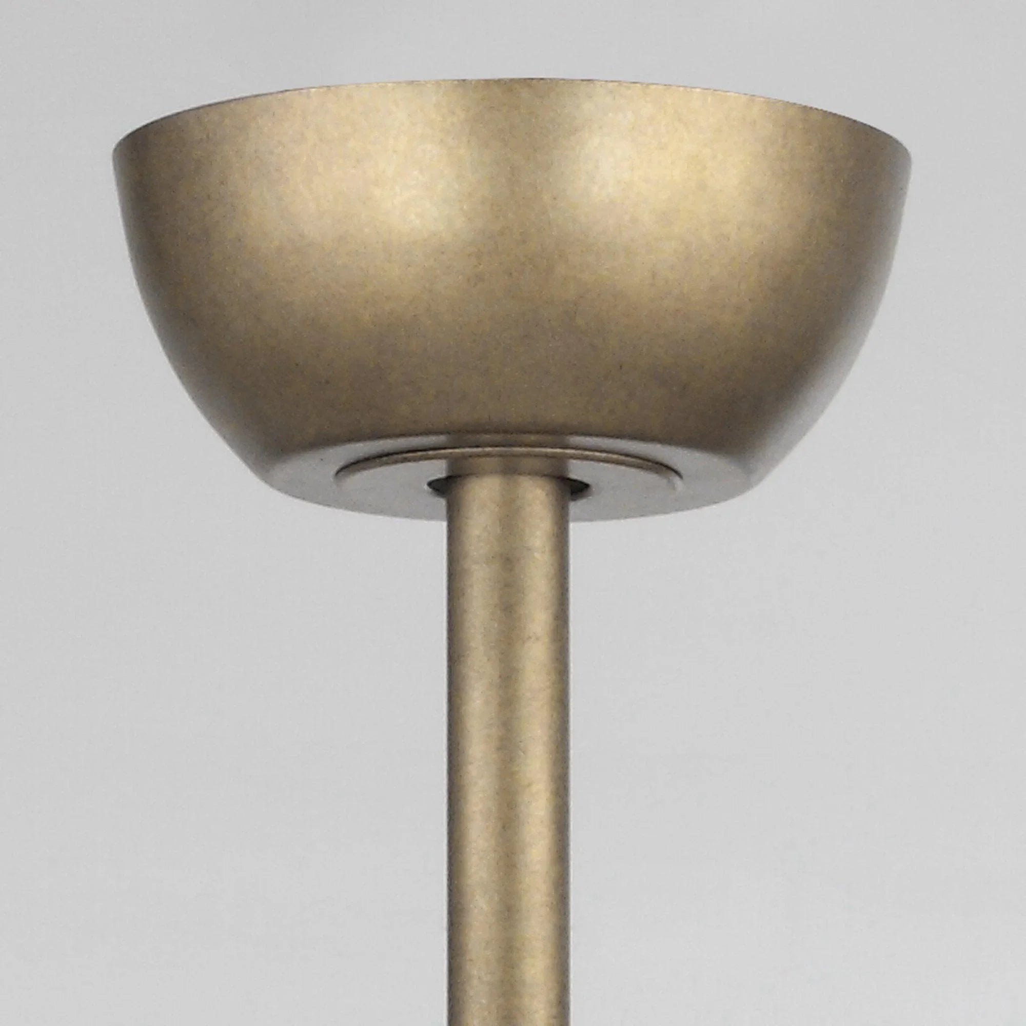 Golden ceiling fan canopy with downrod mount in brushed metal finish