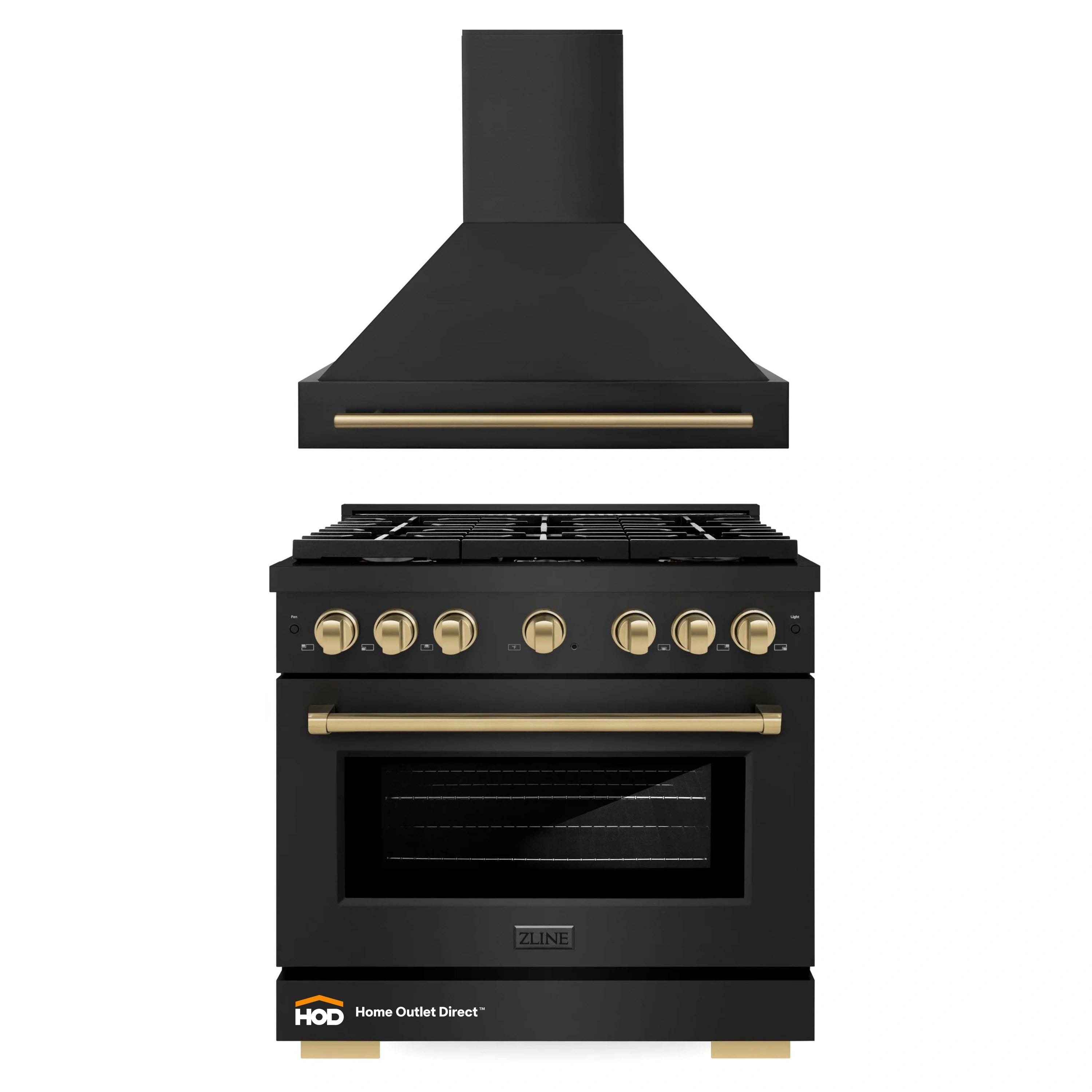 Black wall range hood and gas range with champagne bronze controls and handle