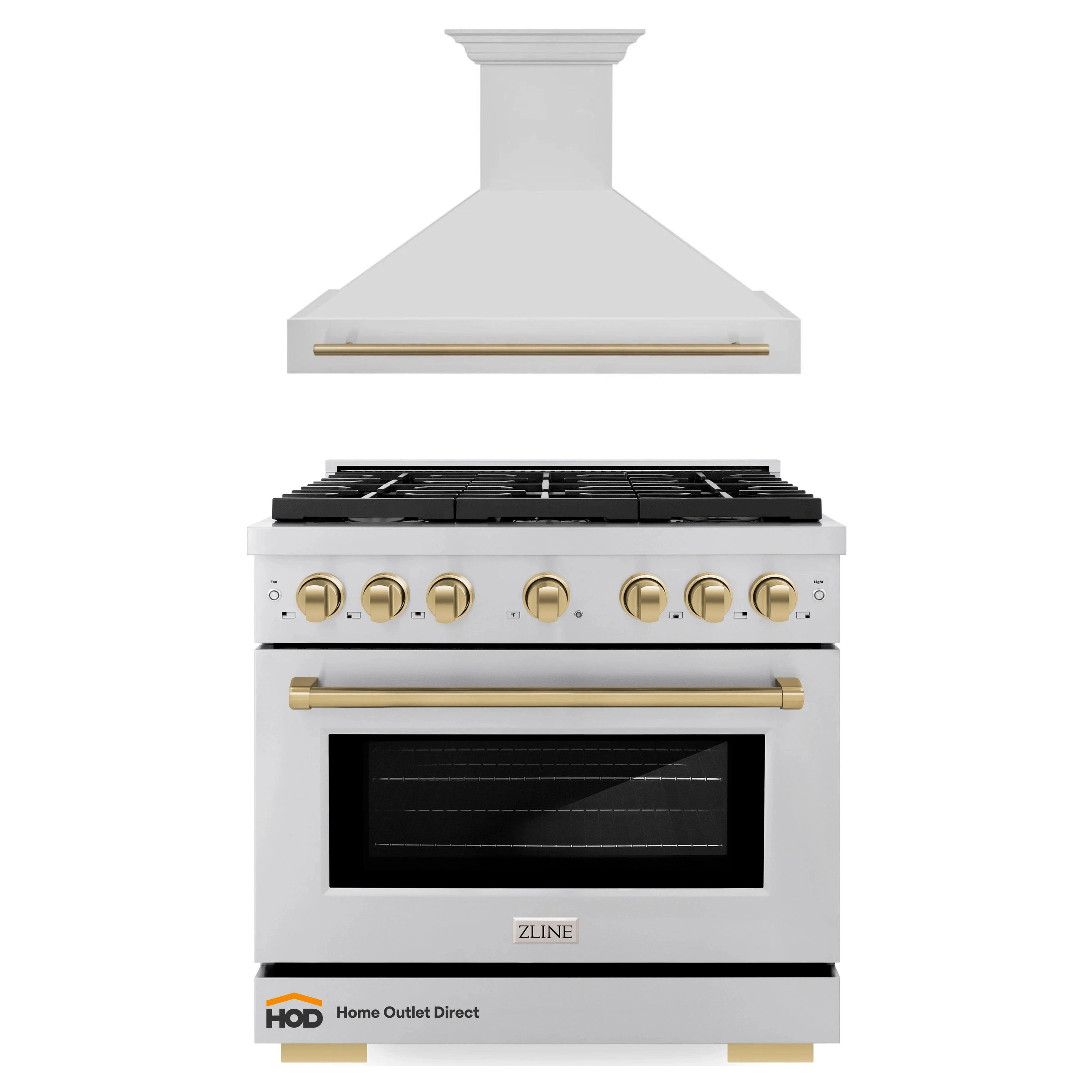 Stainless steel gas range with champagne bronze trim and wall-mounted range hood