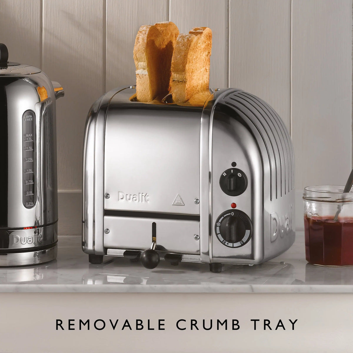 Chrome 2-slice toaster with bread slices in slots and front dial controls
