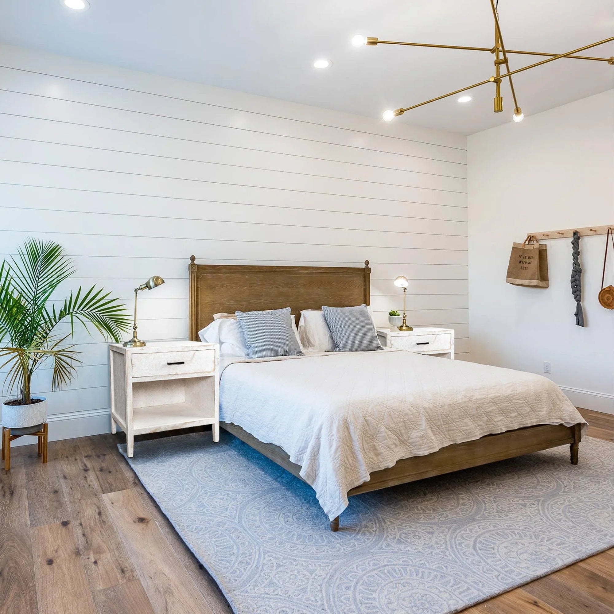 White solid wood nightstand in bedroom with single drawer and open shelf