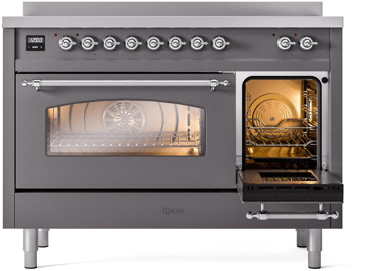 Matte graphite electric induction range with chrome knobs and lit oven cavity