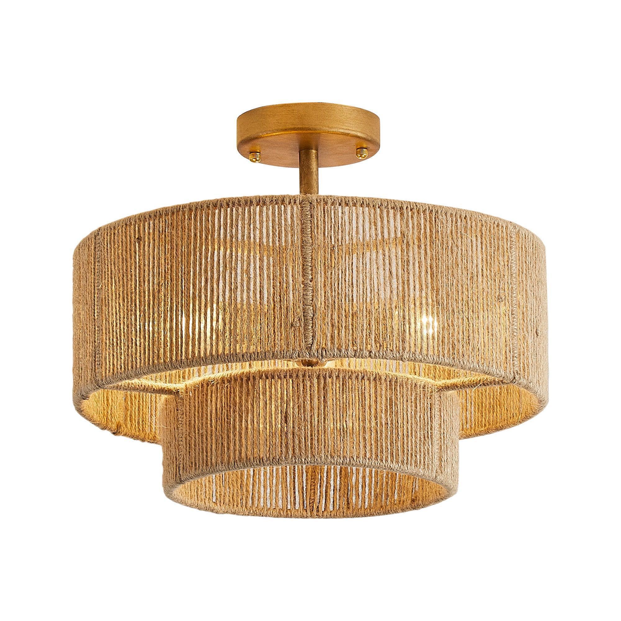 Golden flush mount light with textured woven drum shade and tiered band details.