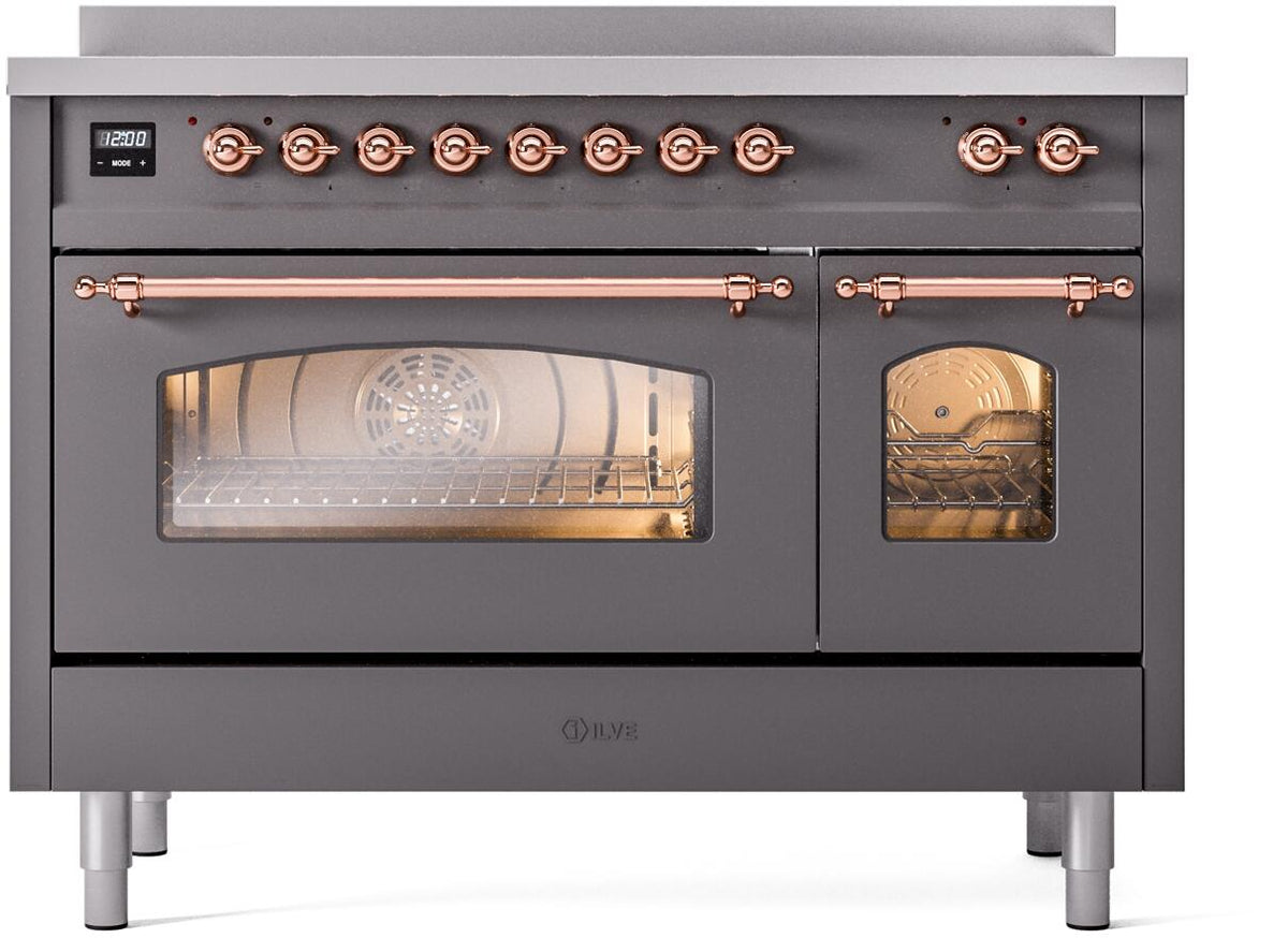 Freestanding electric induction range control panel with copper knobs and matte graphite face