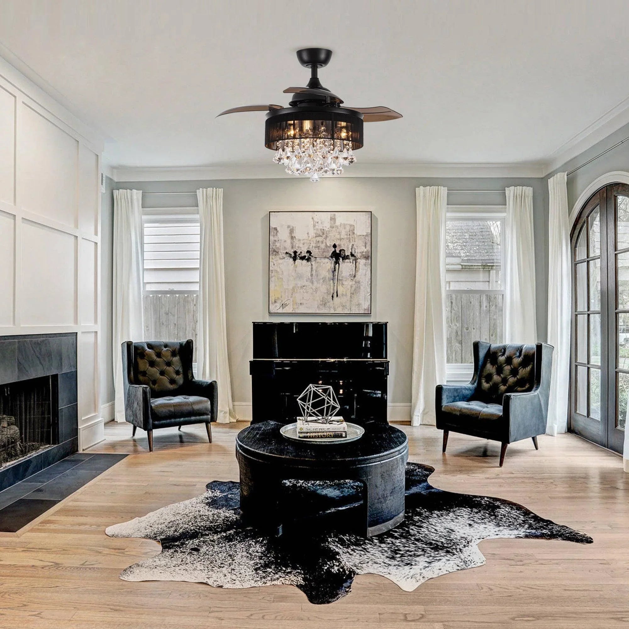 Black crystal ceiling fan with chandelier light centerpiece in a living room setting
