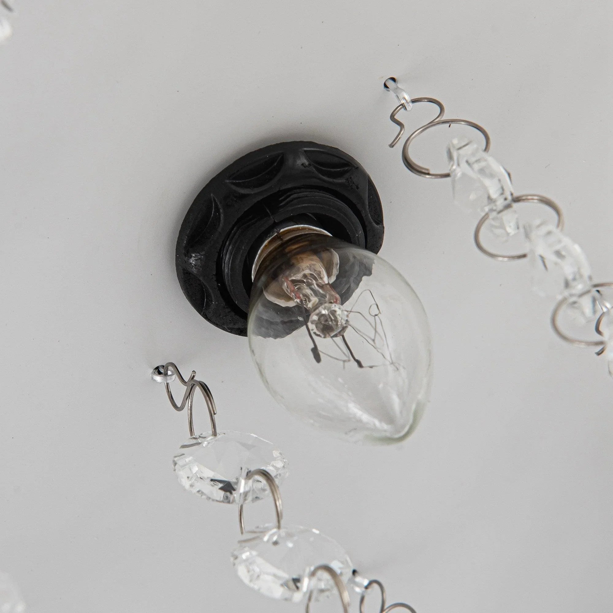 Crystal ceiling fan light sockets with clear bulbs and hanging crystal drops