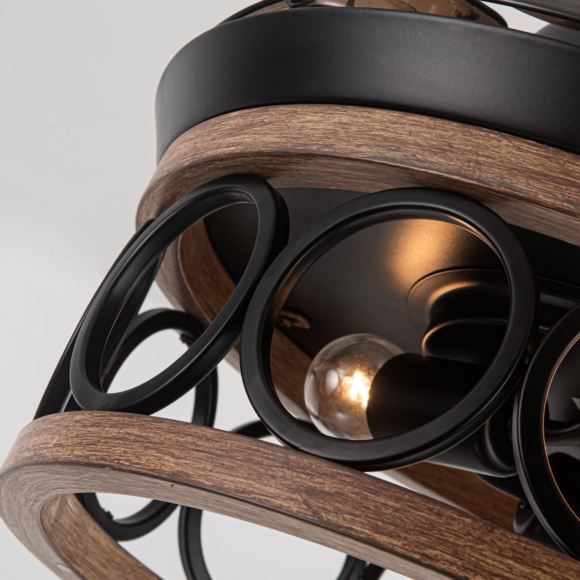 Black ceiling fan light housing with clear bulbs and wood-tone blade band
