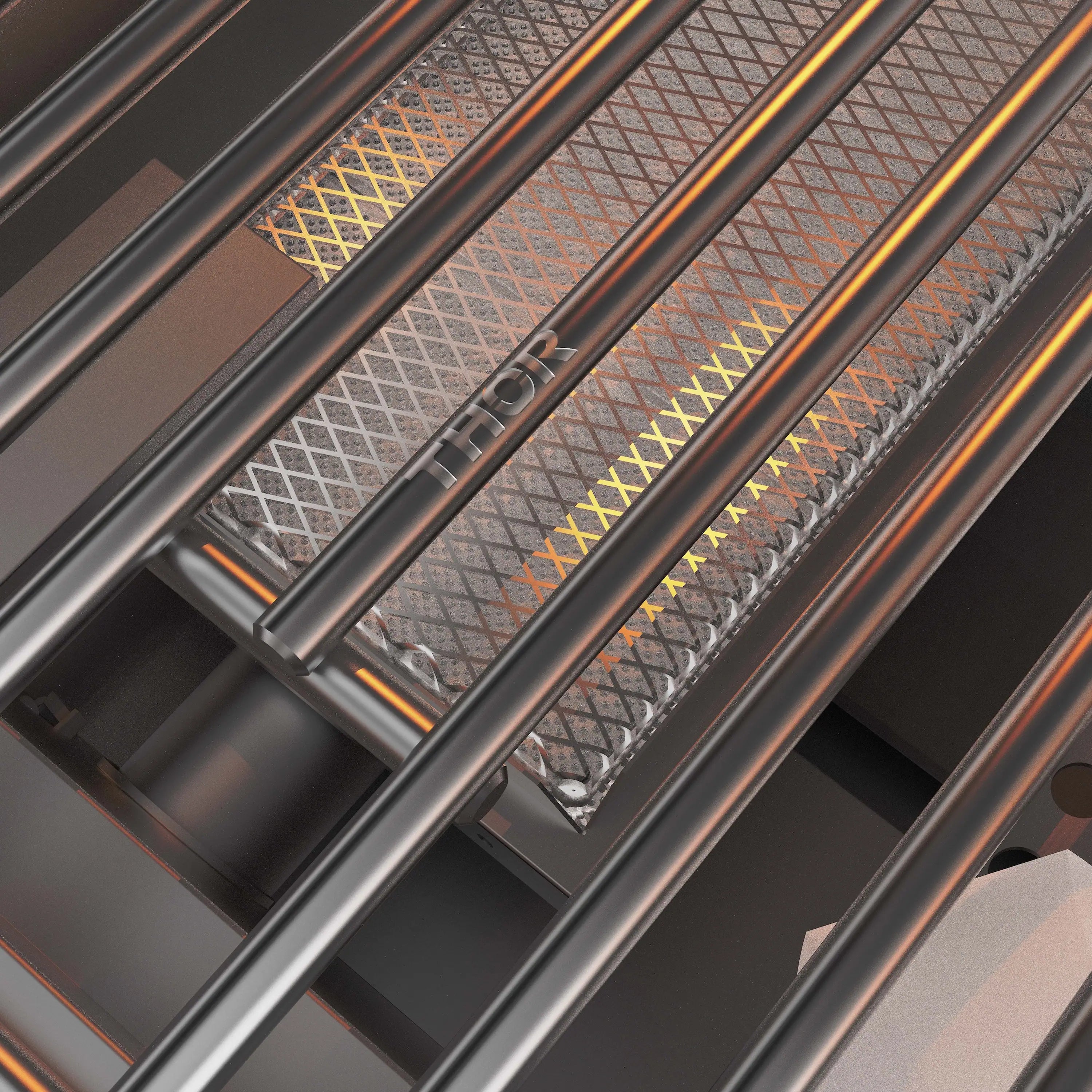 Close-up of stainless burner tubes and heat plates inside a gas BBQ grill