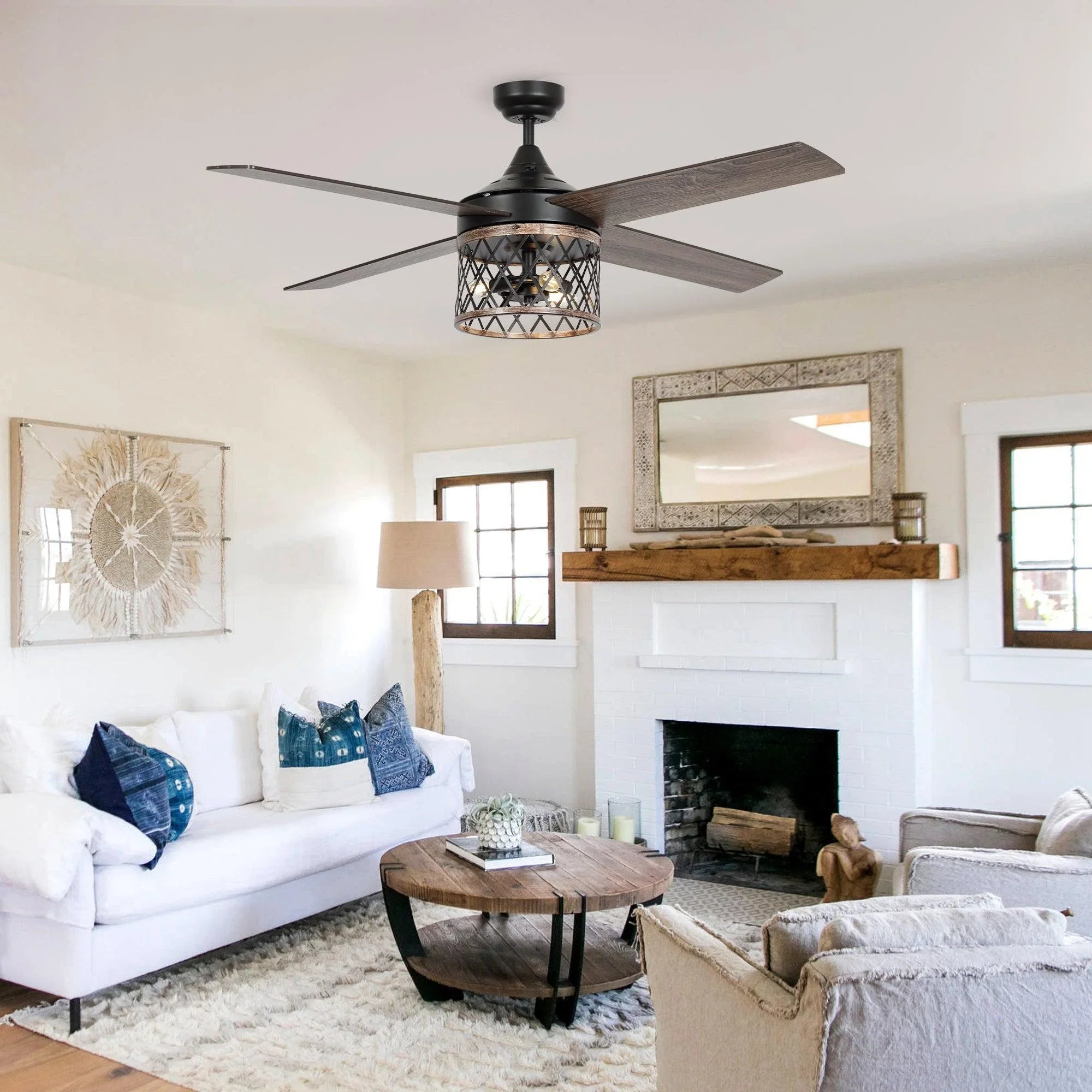 Black ceiling fan with caged light and wood-toned blades in living room.