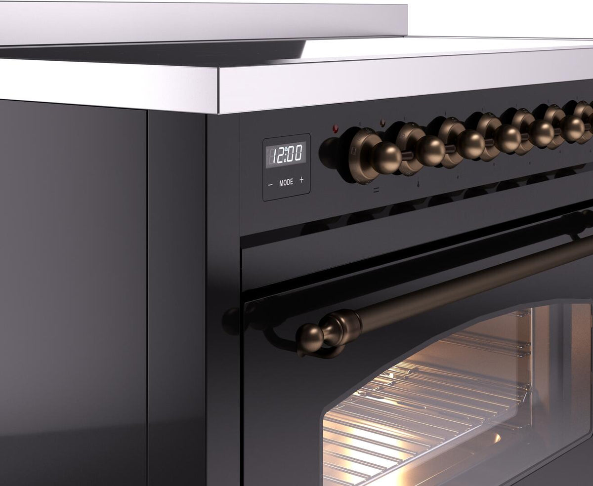 Front control panel close-up with digital display and bronze knobs on black range