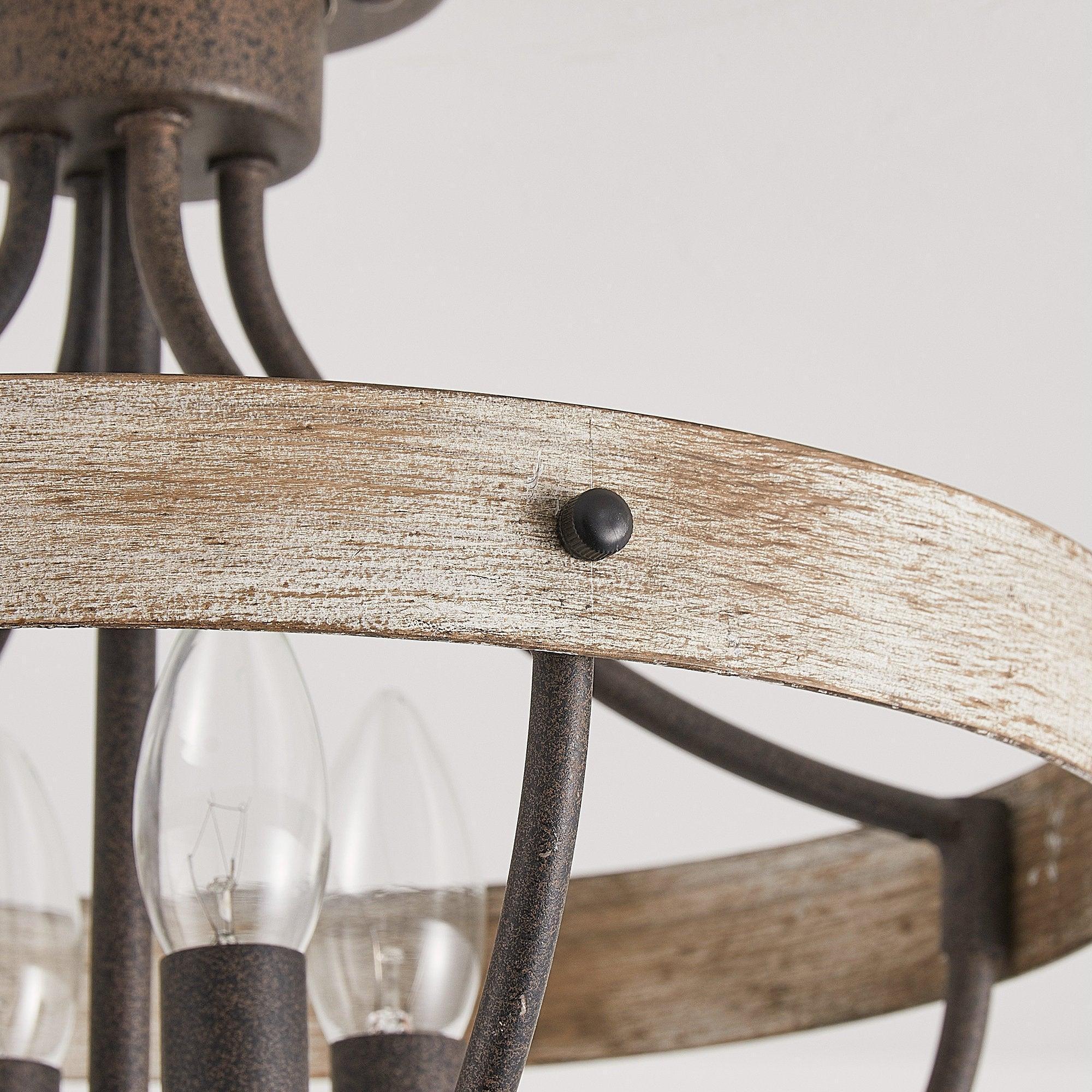 Close-up of brown wood-look ceiling ring with black mounting screw and lamp sockets