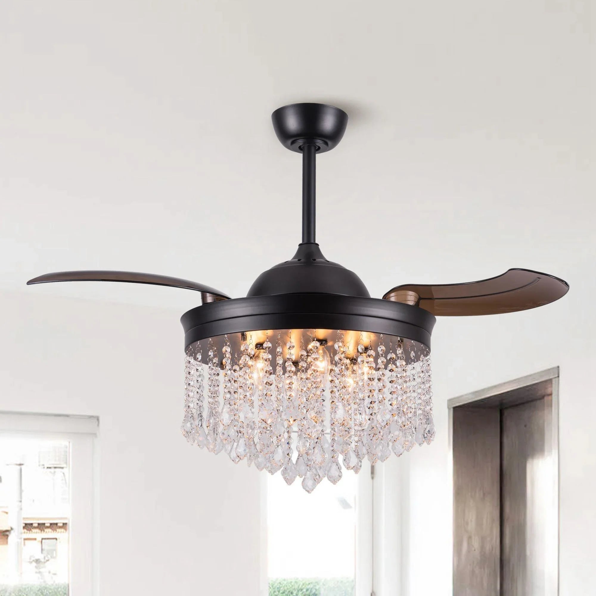 Black ceiling fan with crystal light fixture and three wood-toned blades