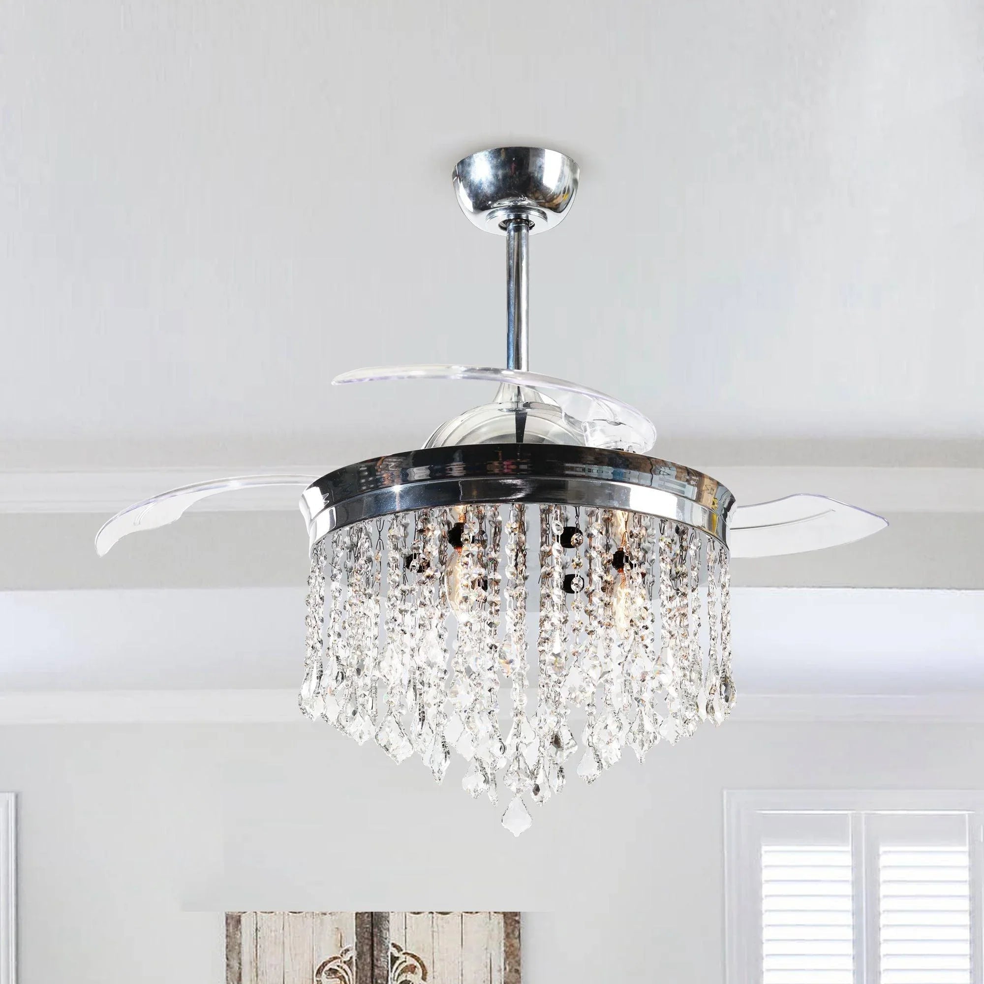 Chrome ceiling fan with crystal drum light mounted on ceiling
