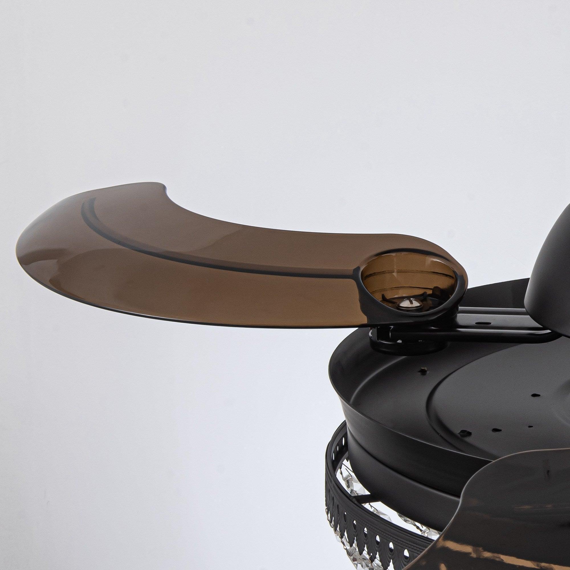Black ceiling fan light housing with clear crystal accents and curved blades