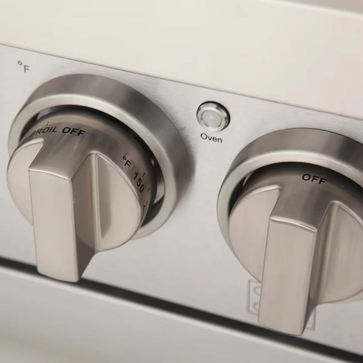Propane gas range oven control knobs in silver with OFF and Broil markings